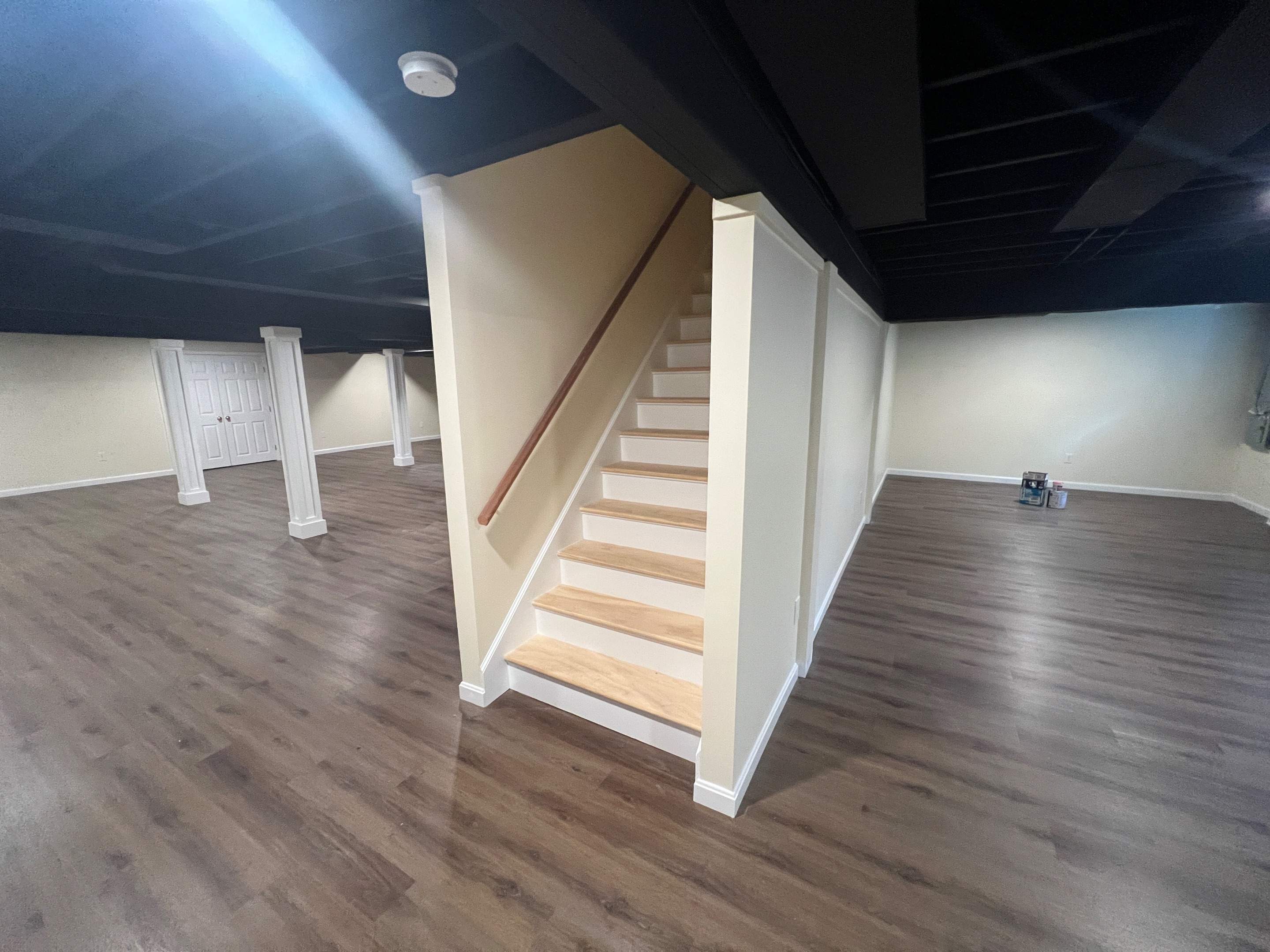 Basement Remodel w/ LVP Flooring & Exposed Ceiling by Chagnon Building & Remodeling LLC