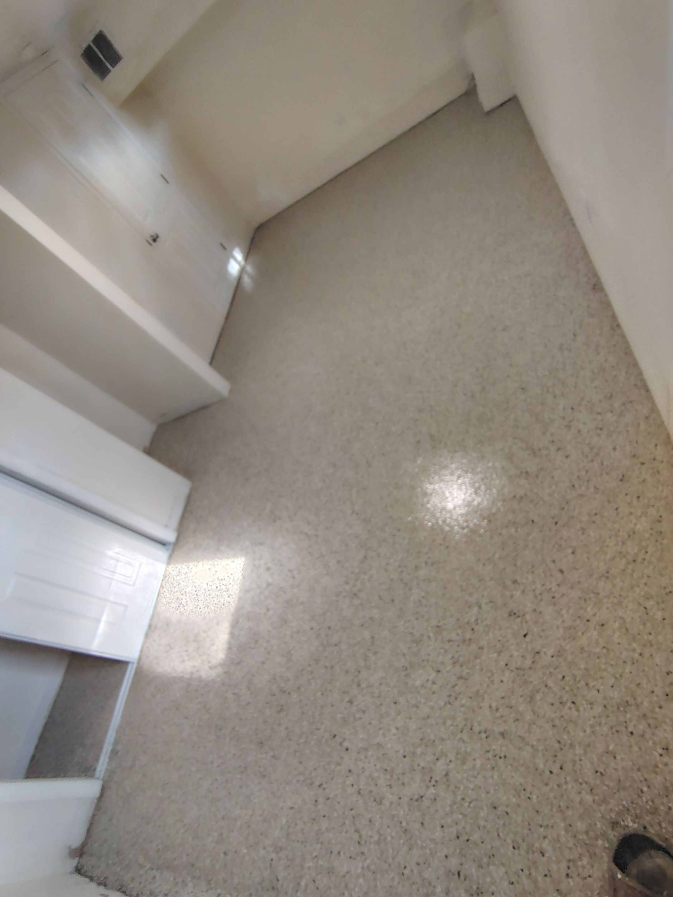 Comprehensive Basement Concrete Floor Coating and Crack Repair in Sioux Falls by Select Painting, Coatings & Garage Cabinets