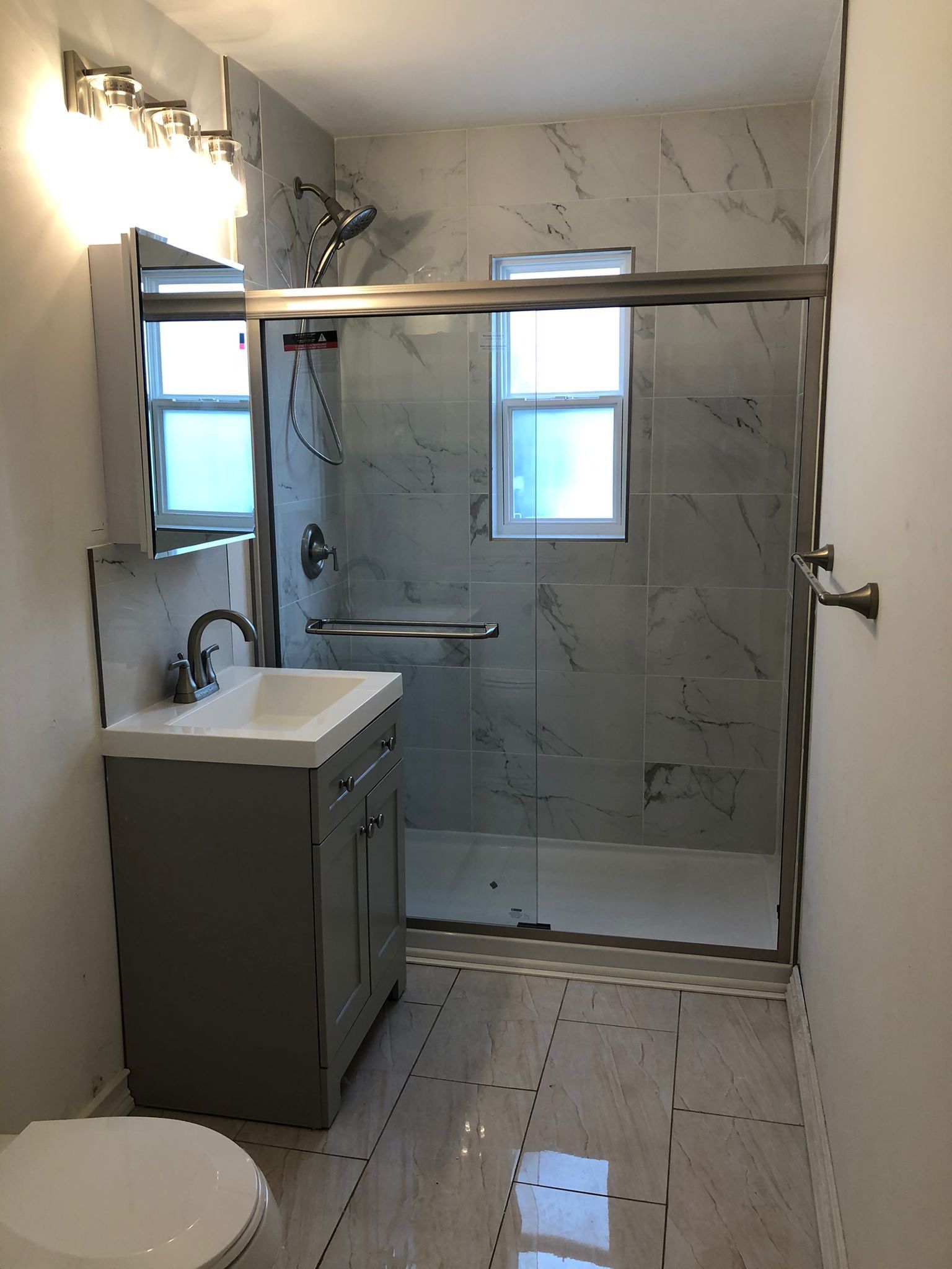 Bathroom Remodel using Tile by Home Concepts Construction