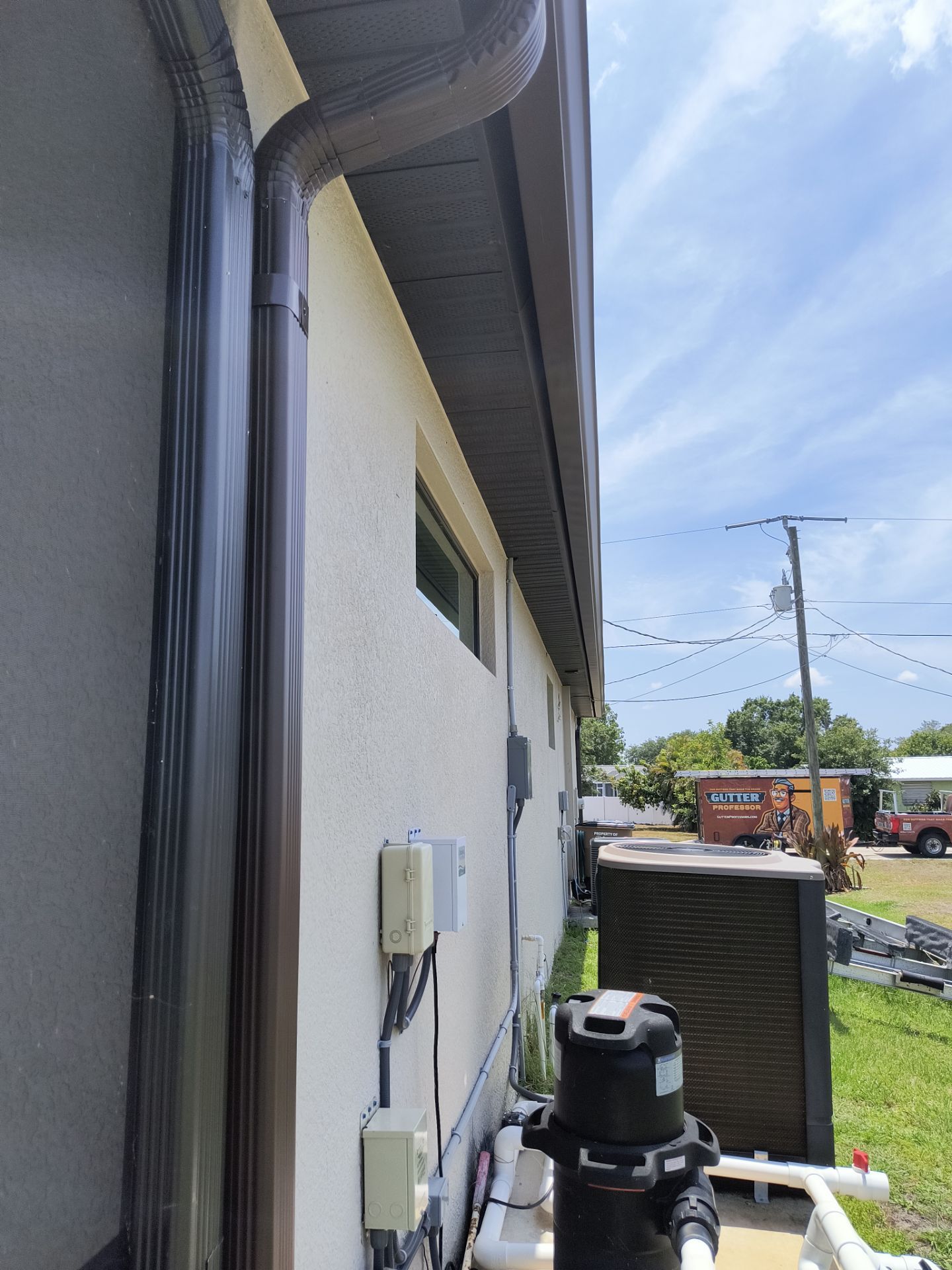 Custom Seamless Gutters and Downspouts for Large Homes in Tampa FL by Gutter Professor by Gutter Professors