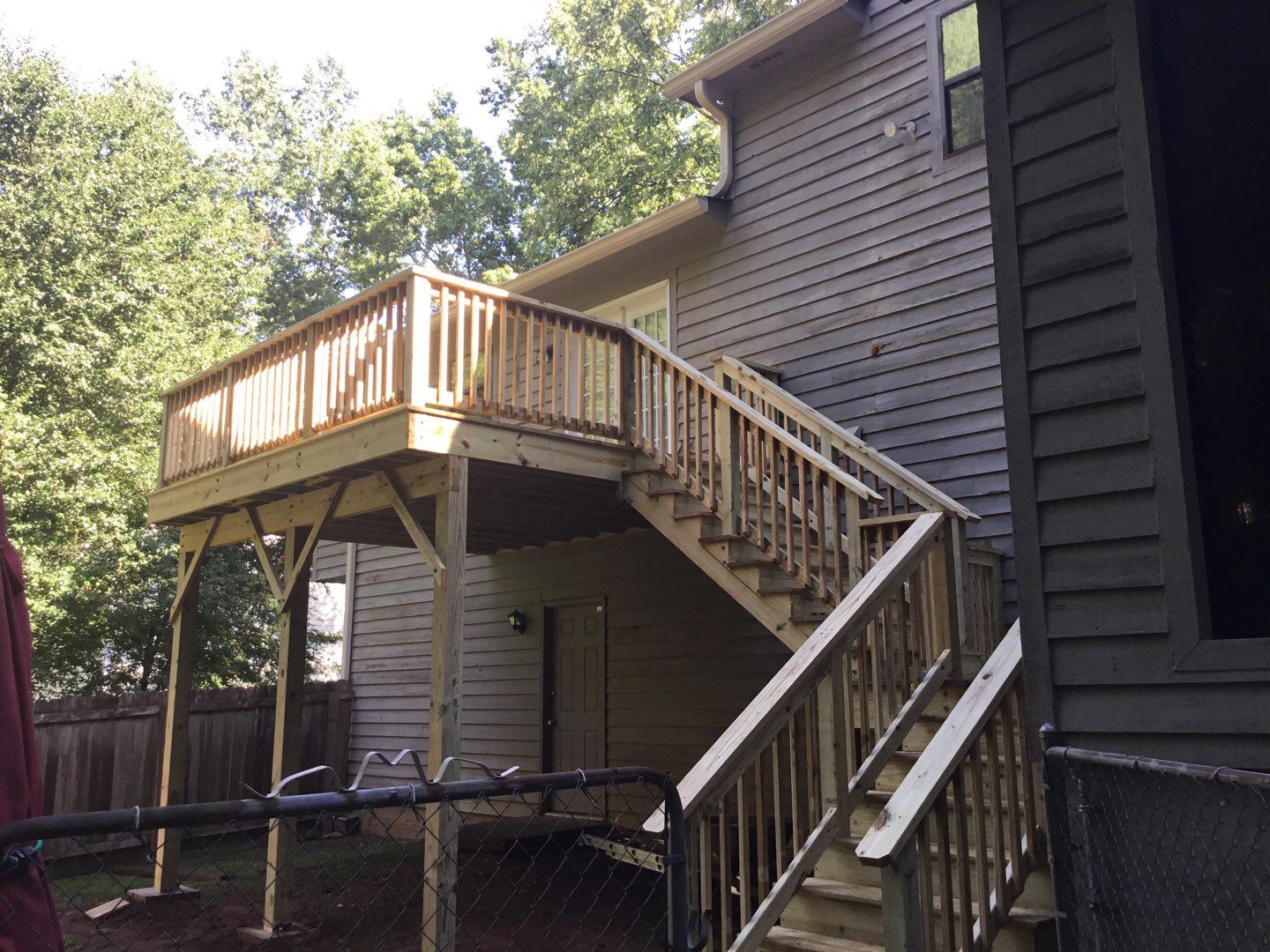 Elevated Wooden Deck and Front Porch Renovation in Marietta by Swift Home Renovations 