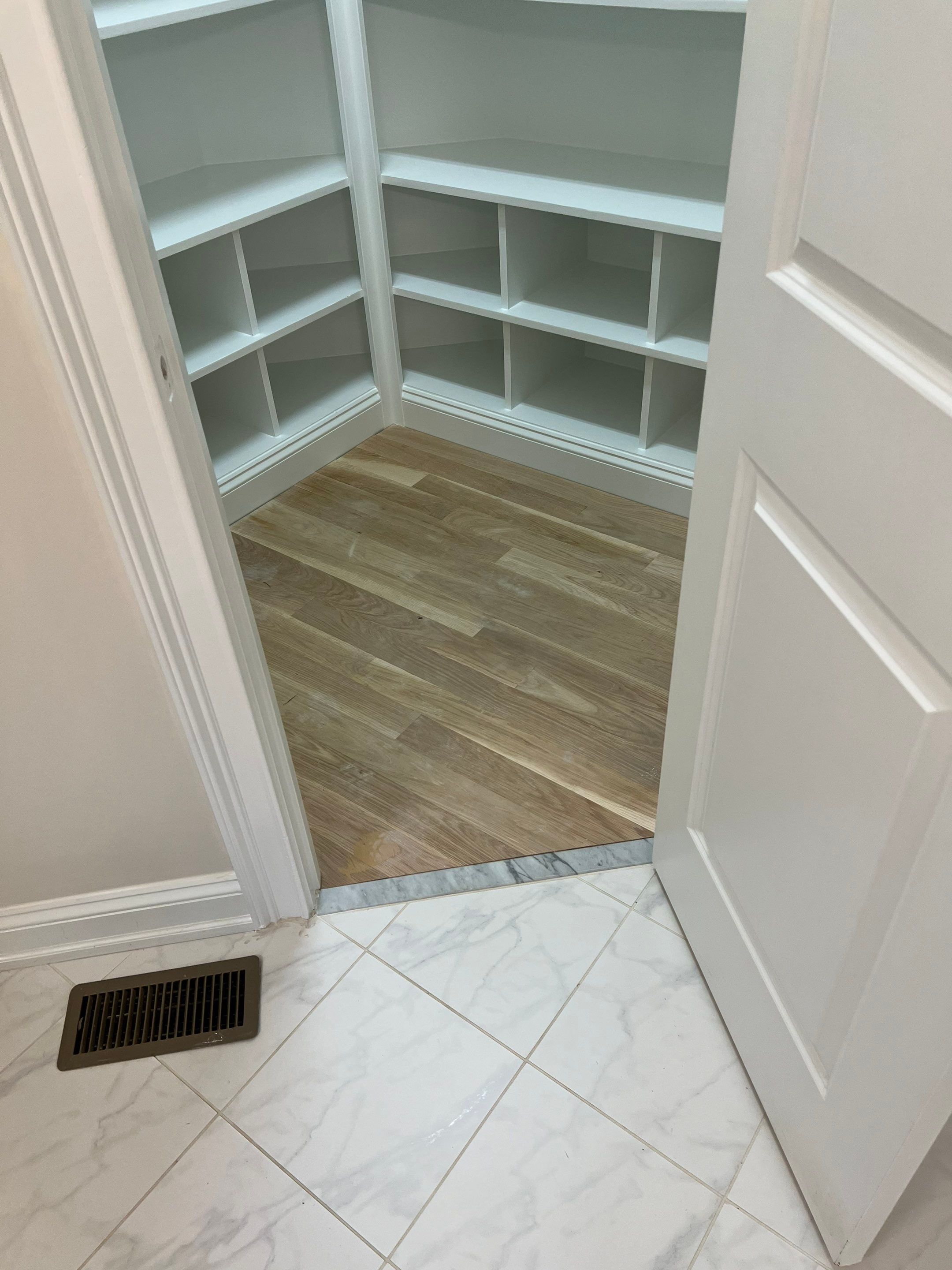 Adding hardwood floors to bedrooms by Accent Custom Floors