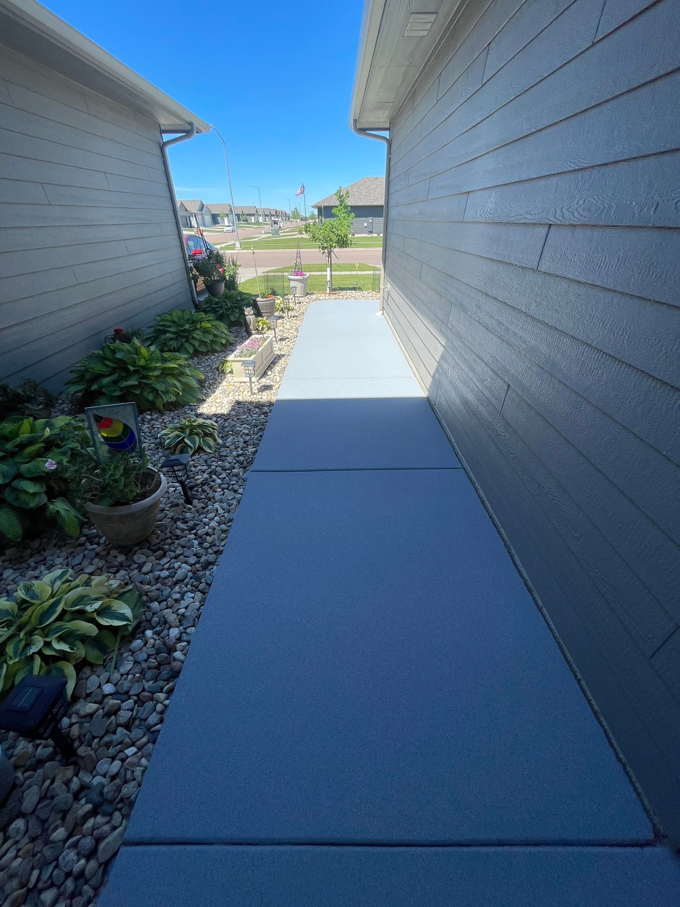 Custom Concrete Coating for Sioux Falls Patio and Front Walkway by Select Painting, Coatings & Garage Cabinets