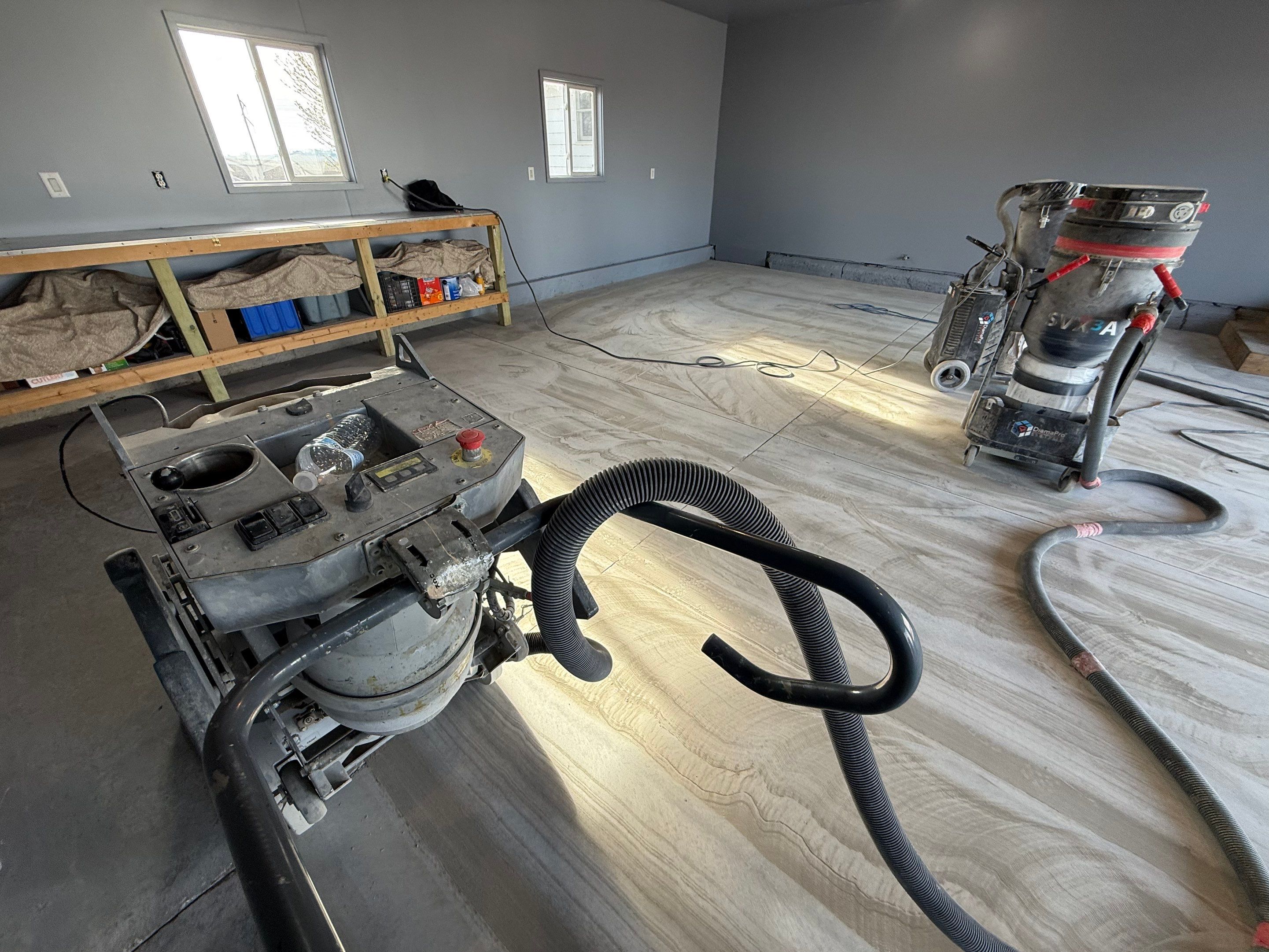 Grey Granite-Style Garage Floor Coating and Stairs in Hartford by Select Painting, Coatings & Garage Cabinets