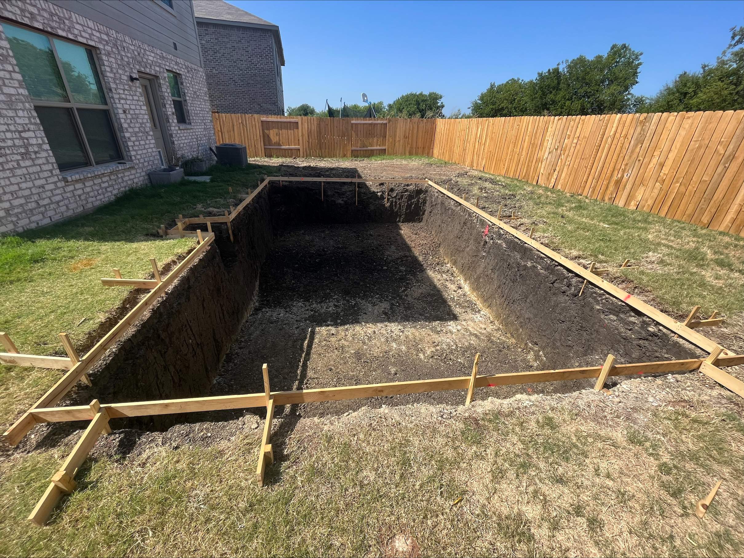Geometric Pool with Stone Deck and Coping by Pinnacle Pools and Spas - DFW
