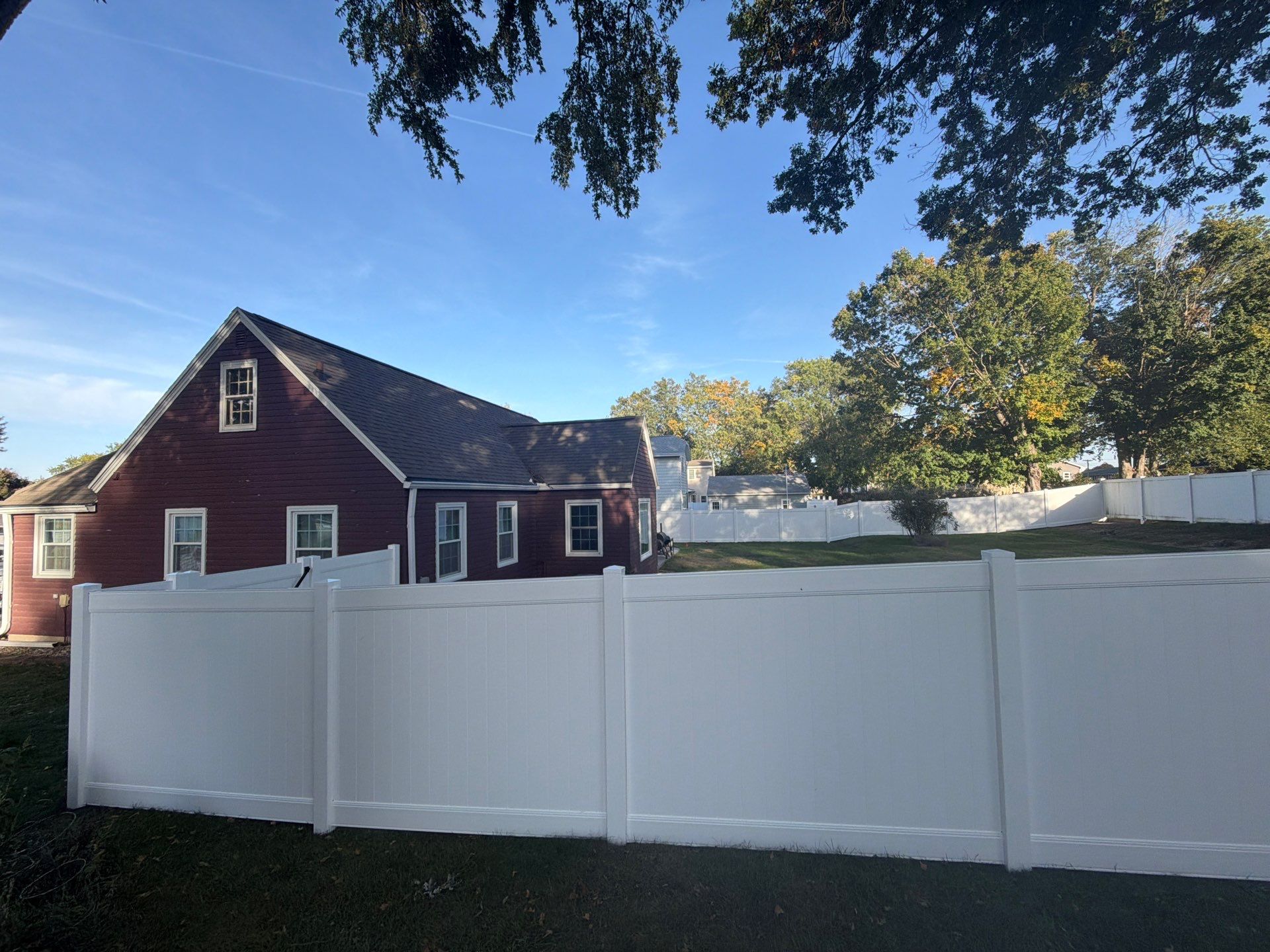 White Vinyl Privacy Fence and Gate Installation in Grundy Center by Perfect Picket Fence and Stain