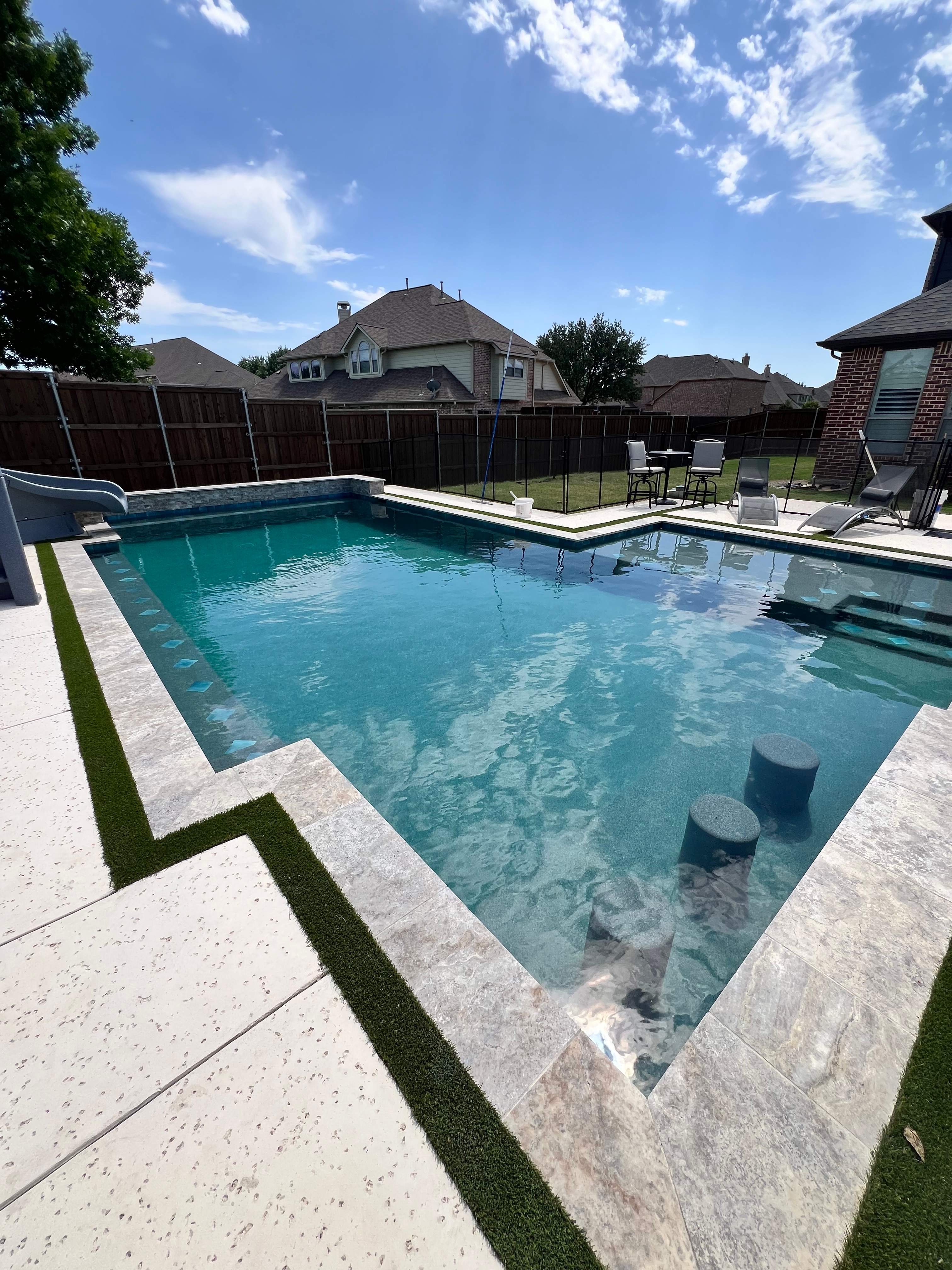 Geometric Pool with Raised Spa and Slide by Pinnacle Pools and Spas - DFW