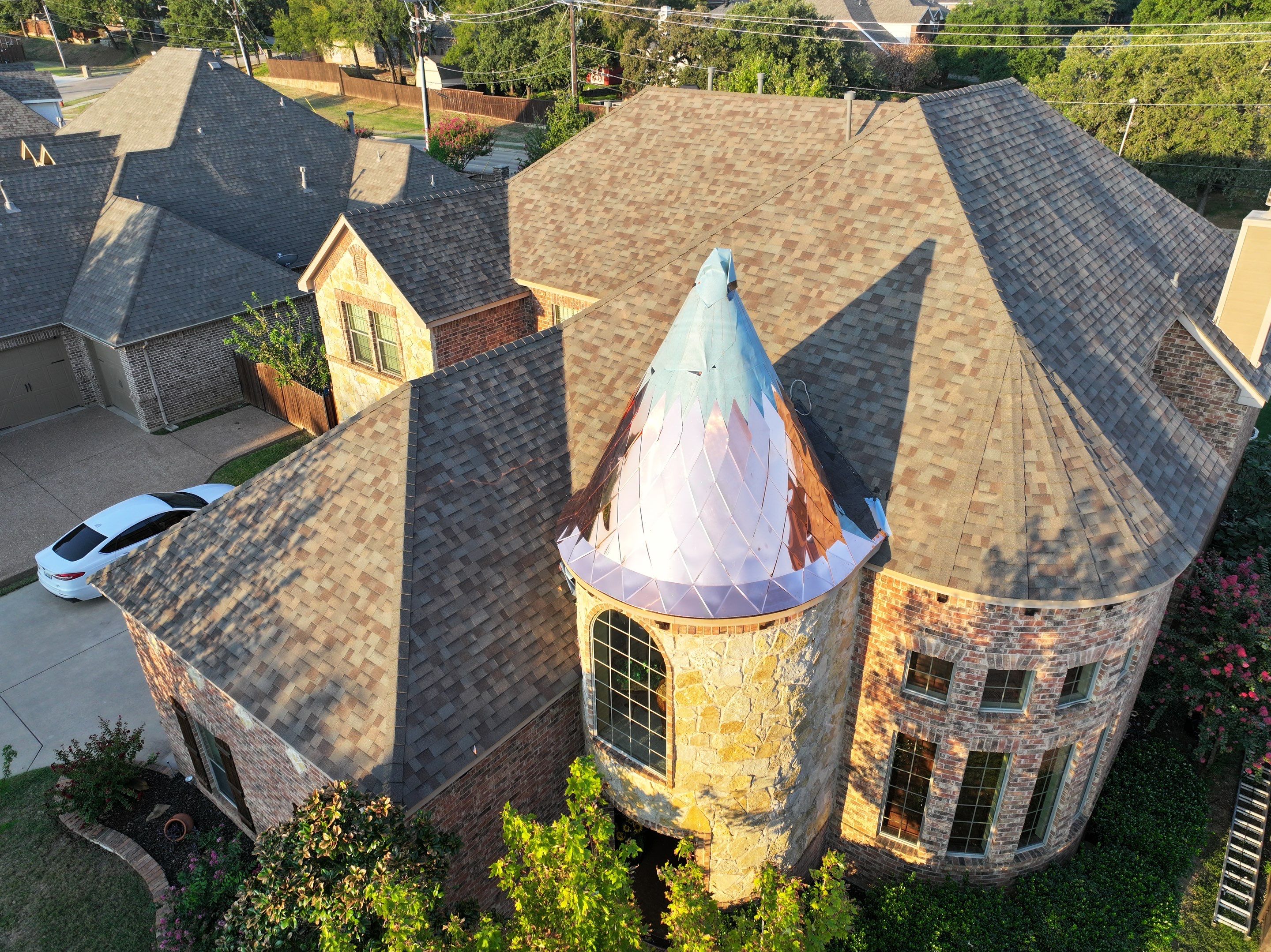 Installing Custom copper turret and Malarkey Vista Class 4 shingles Hail Damage Upgrade by Becker Roofing and Exteriors