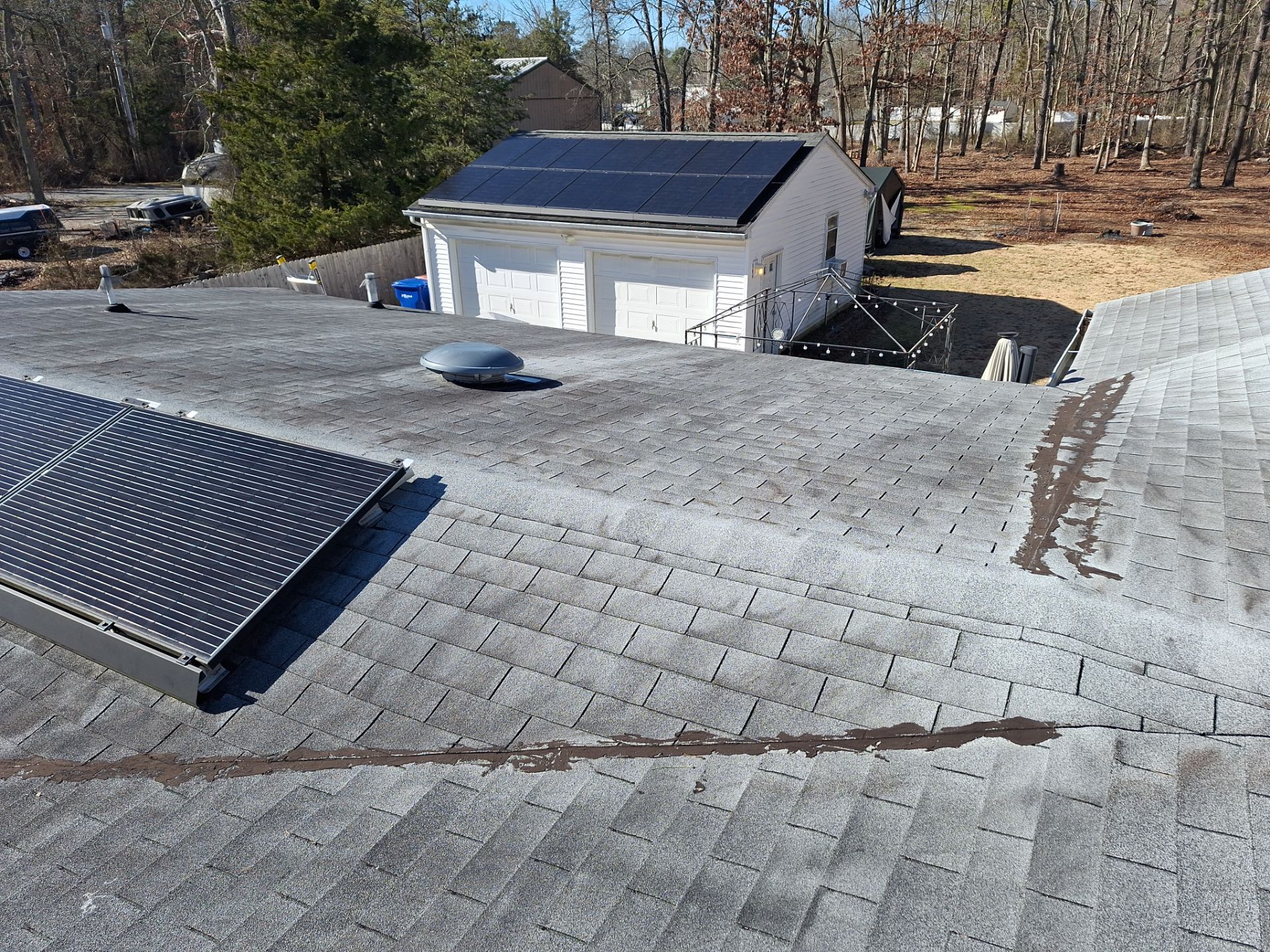 Onyx Black Shingles by Reimagine Roofing
