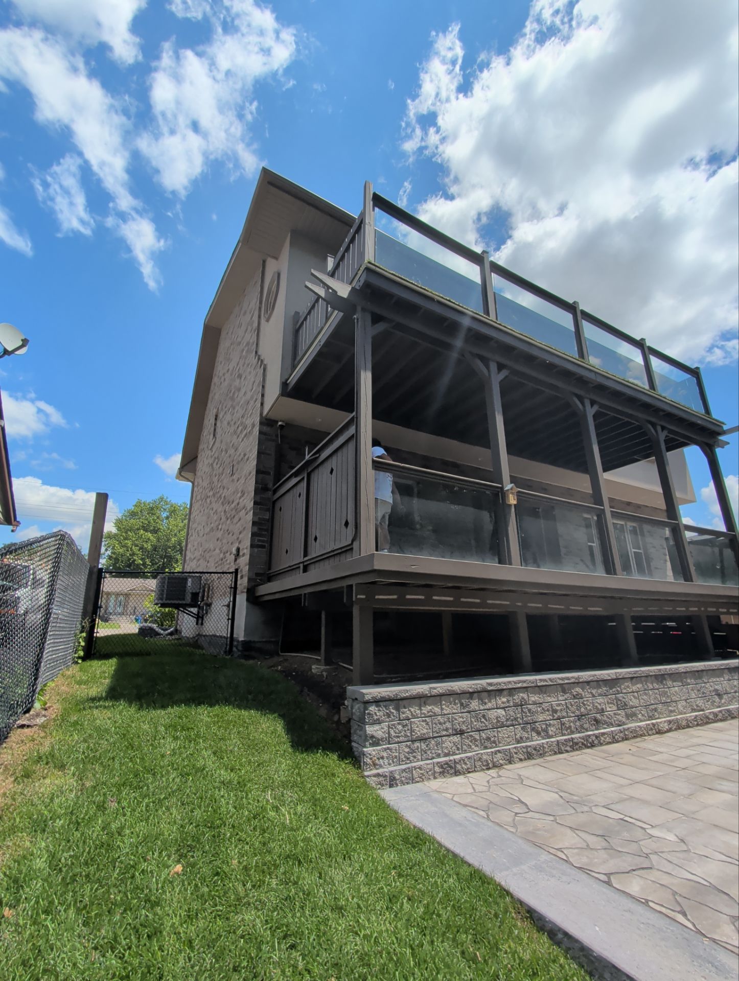 Multi-Level Deck Restoration and Glass Railing Installation in King by GTA HOME PAINTING