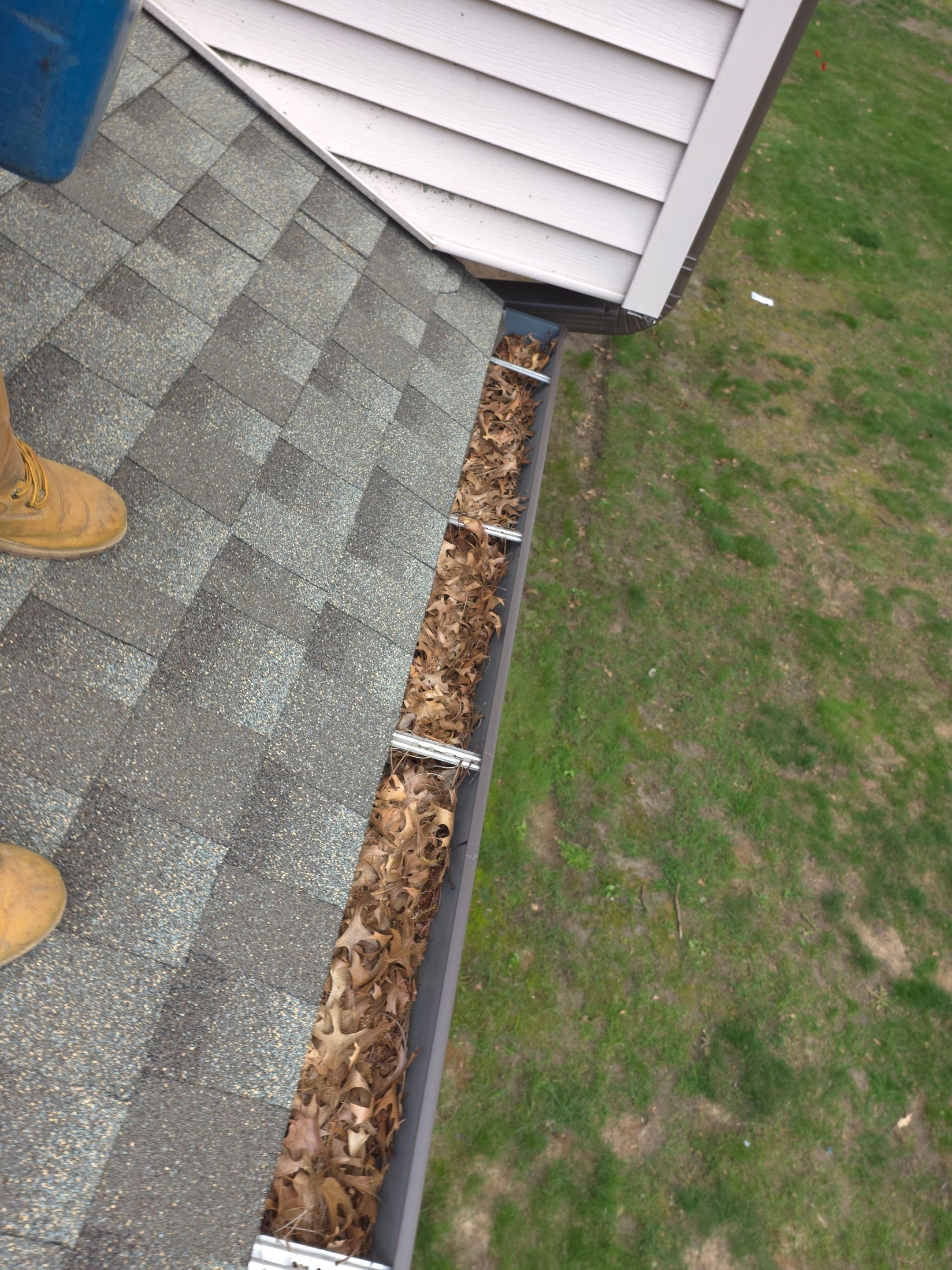 Commercial gutter cleaning Eau Claire before photo with filled gutters