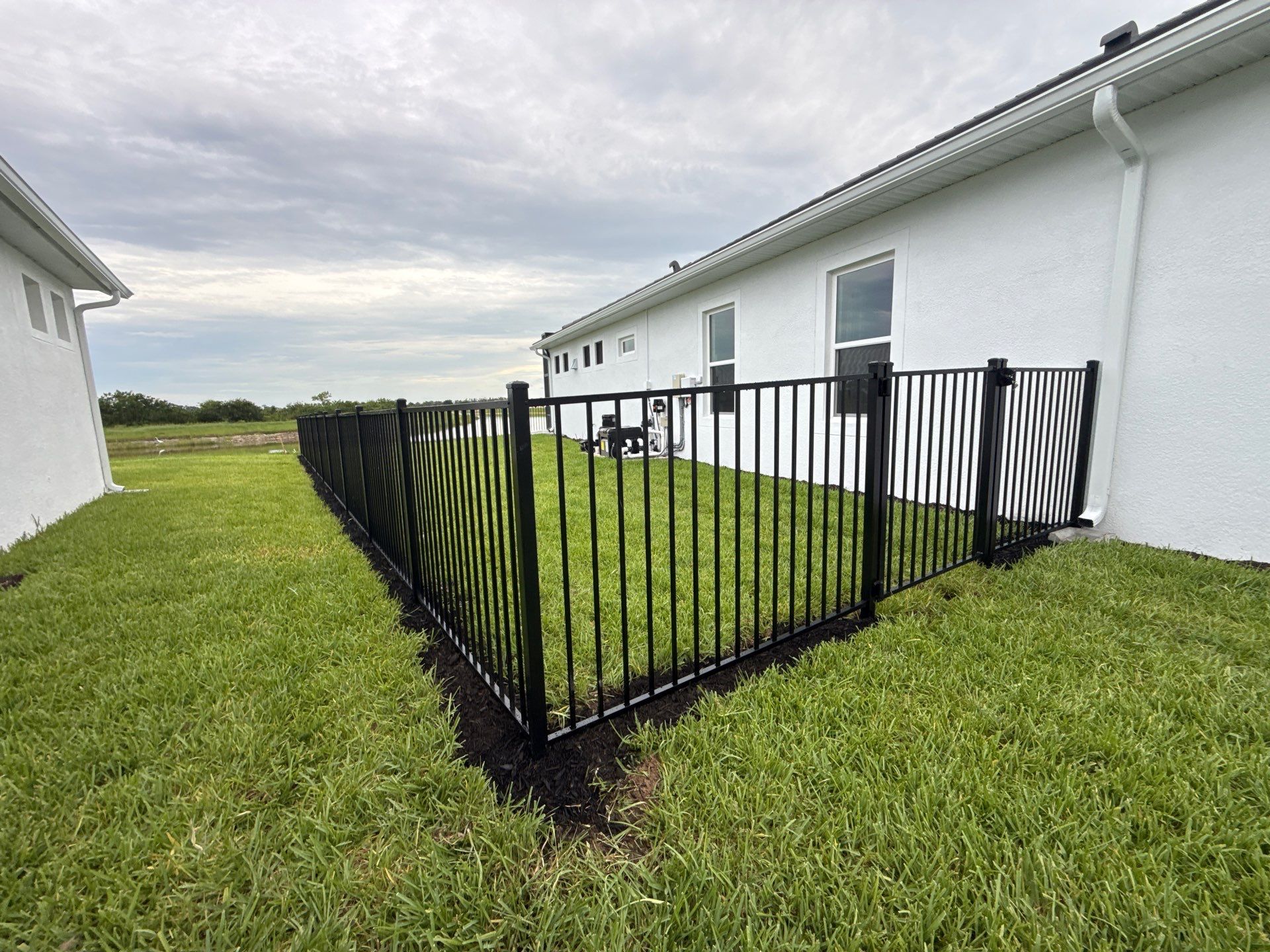 Black Aluminum Picket Fence Installation in Venice, Florida by True Fence LLC