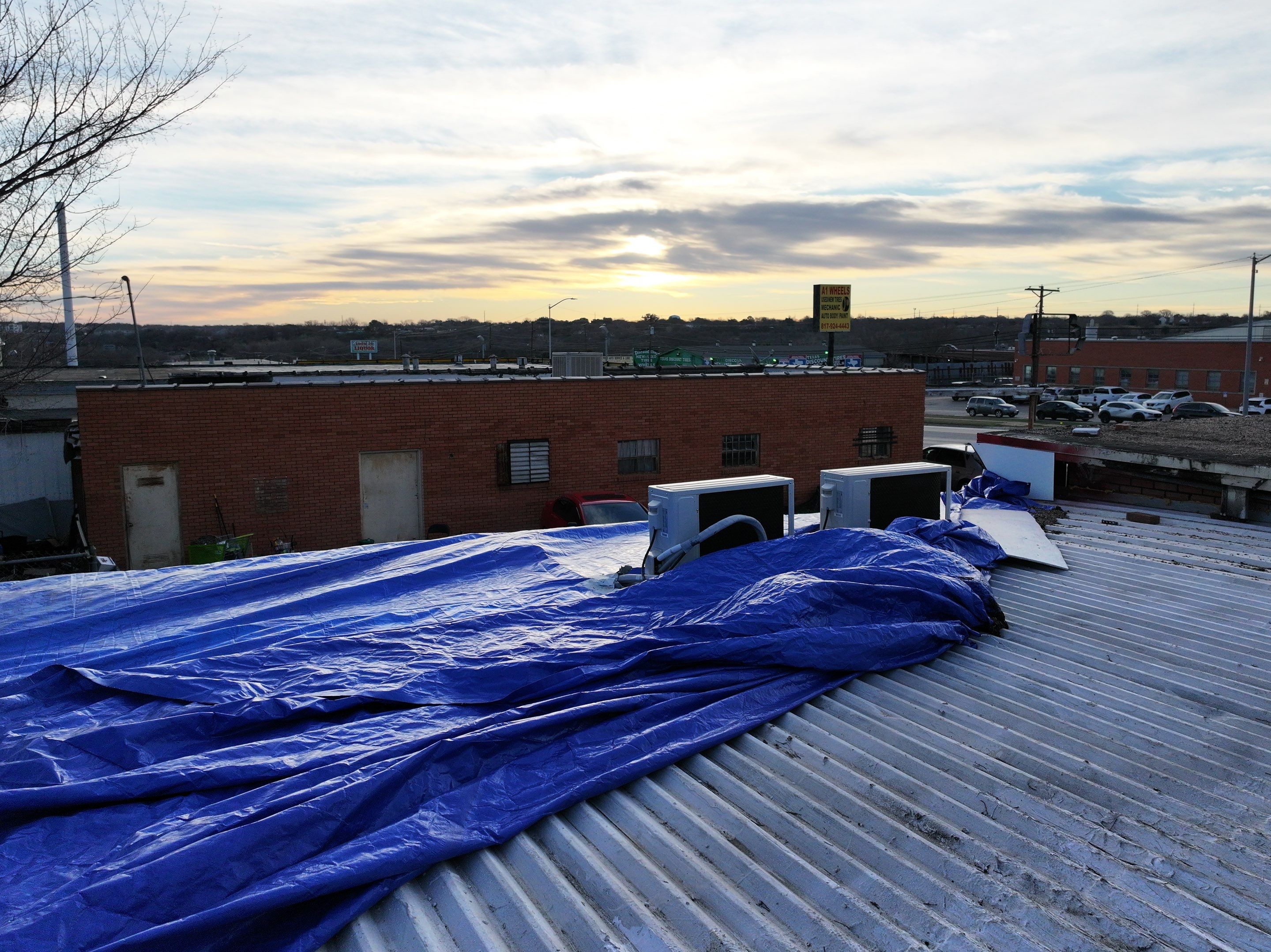 Commercial roofing overlay using GAF TPO over an old ballast roof by Becker Roofing and Exteriors