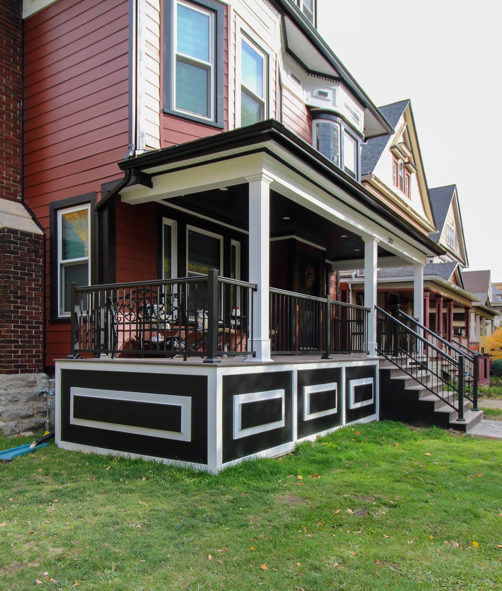 Exterior Renovations- Siding, Stamped Concrete, Porch, and Railings by Ivy Lea Construction