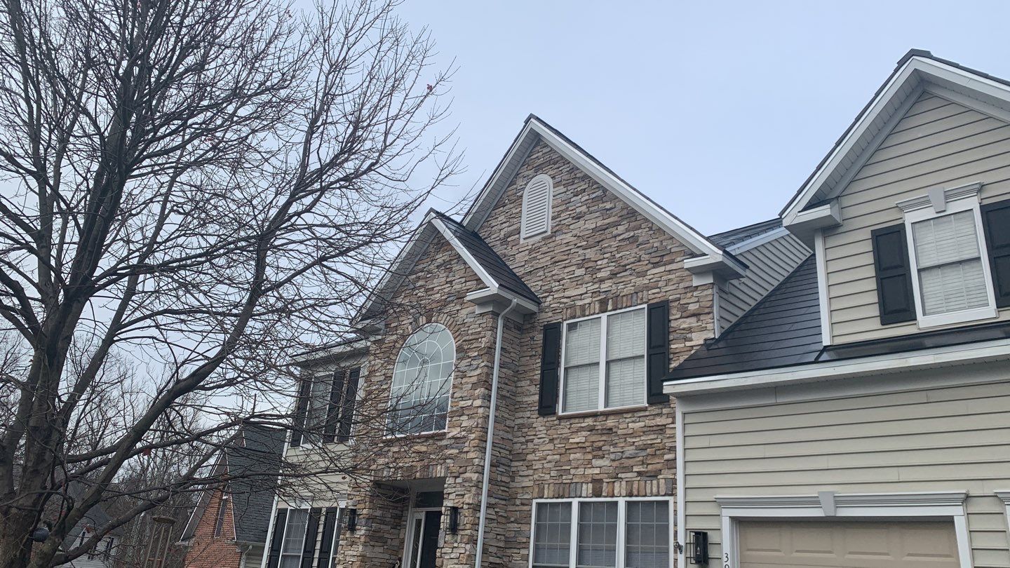 Tesla Solar Roof and Gutter Installation by American Home Contractors