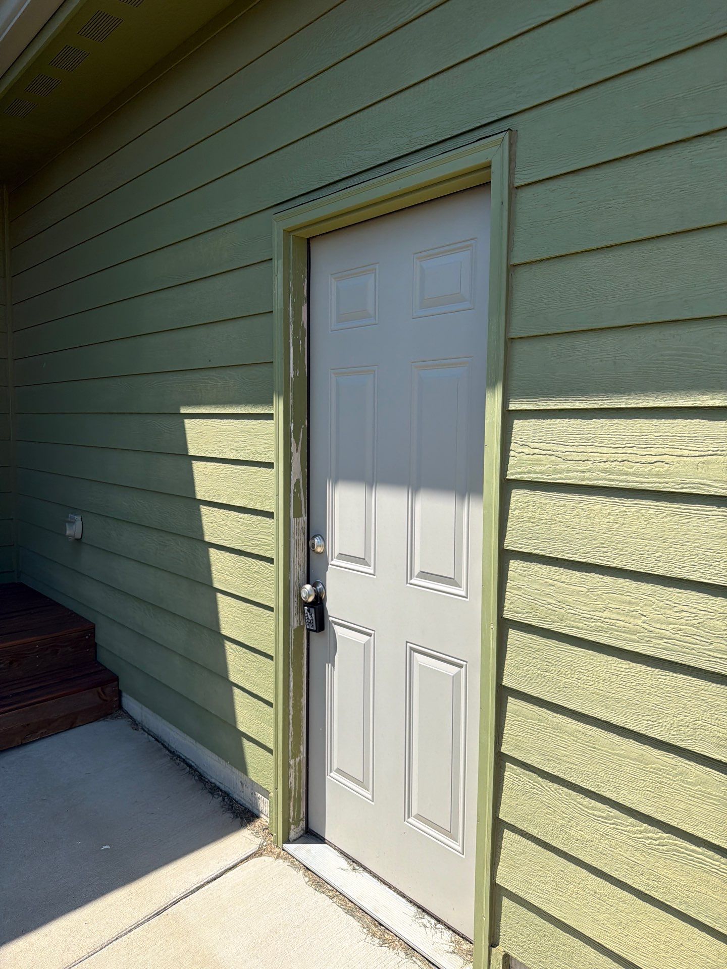 Exterior Painting and Custom Deck Construction in Sioux Falls by Select Painting, Coatings & Garage Cabinets