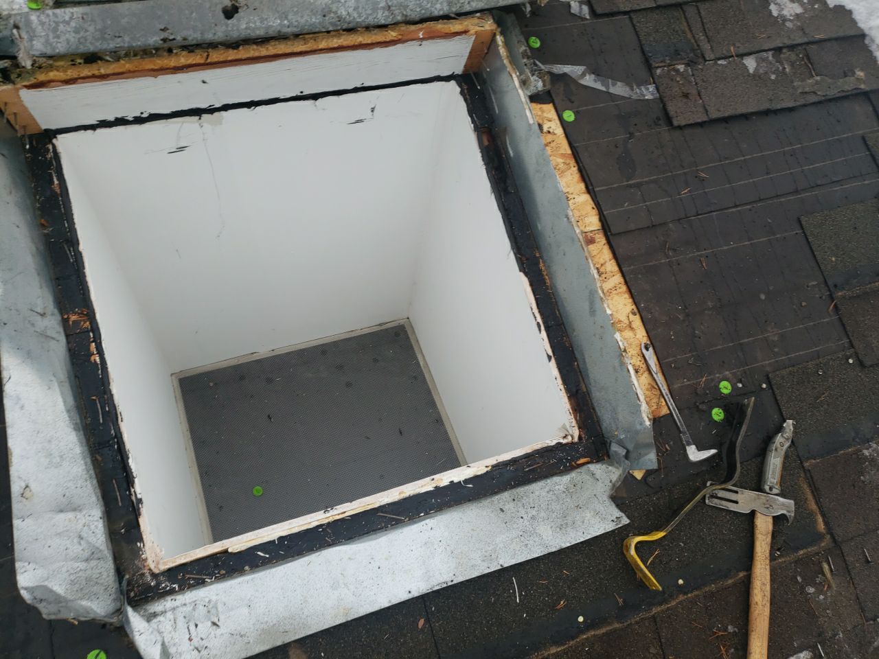 Skylight Removal using Shingle Repair by The Roof Doctor