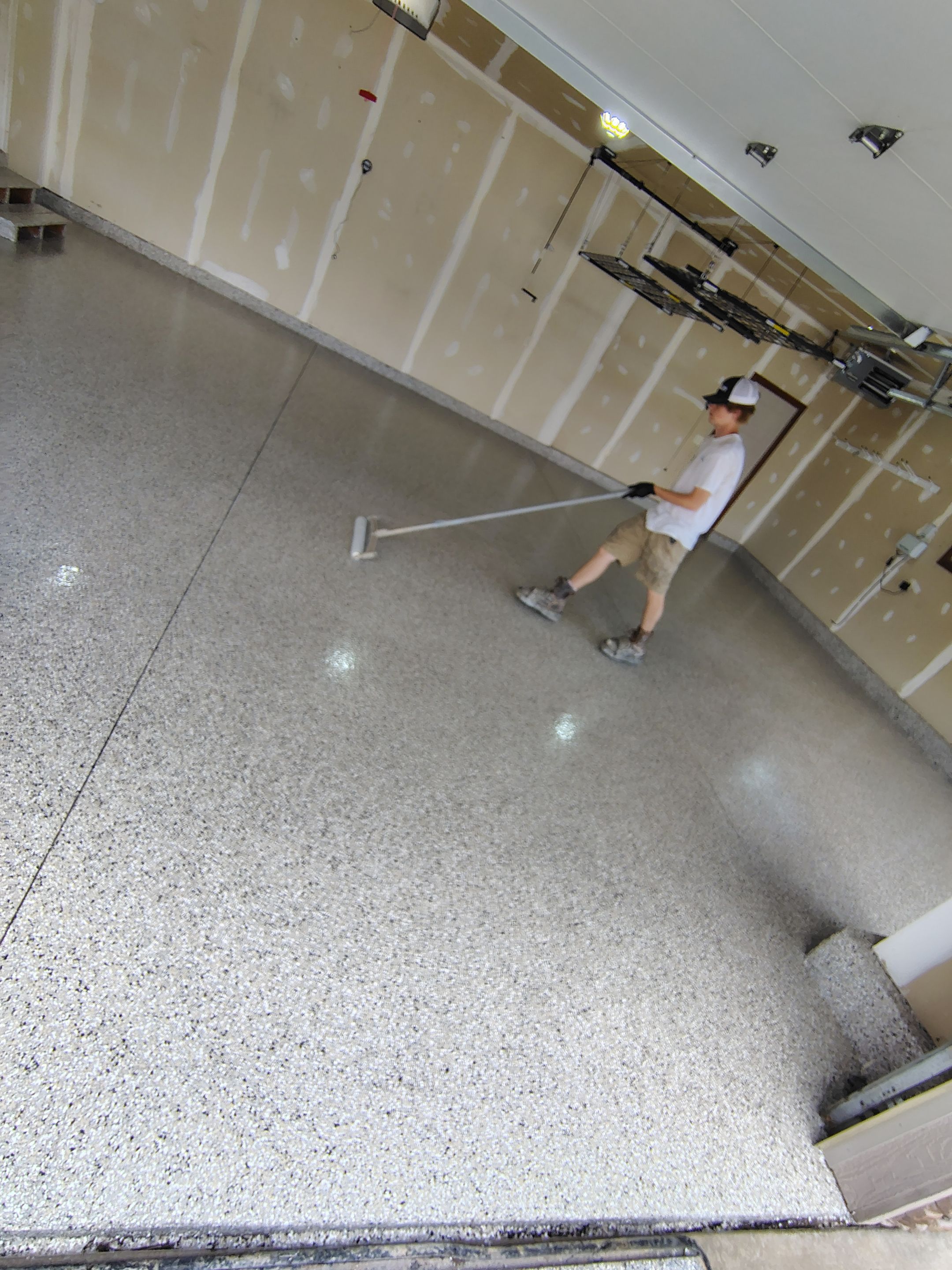 Multi-Car Garage Concrete Coating and Epoxy Finish in Sioux Falls by Select Painting, Coatings & Garage Cabinets