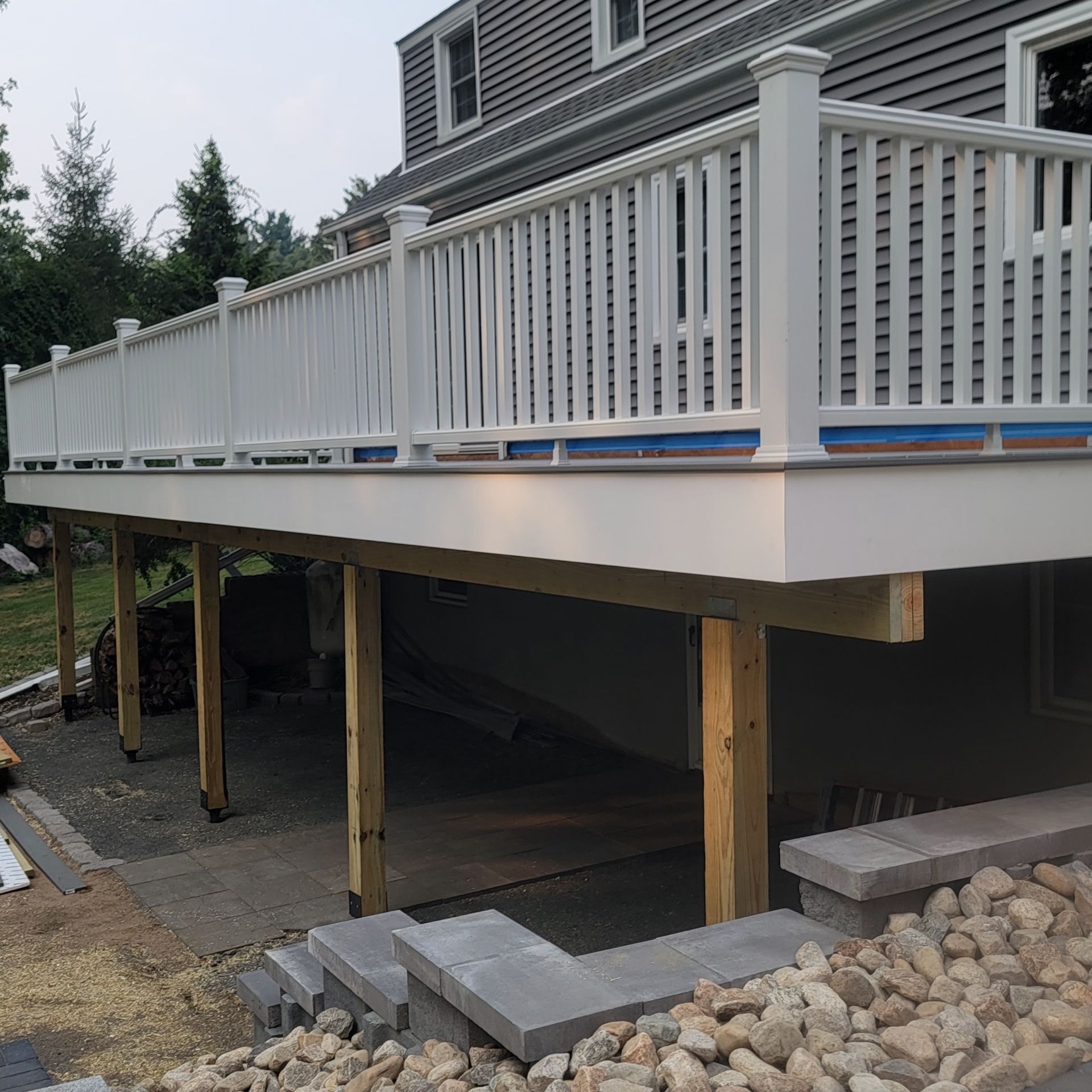 Deck replacement using Trex Select Pebble Gray and transcend White railing. by DiGiorgi Roofing and Siding Inc