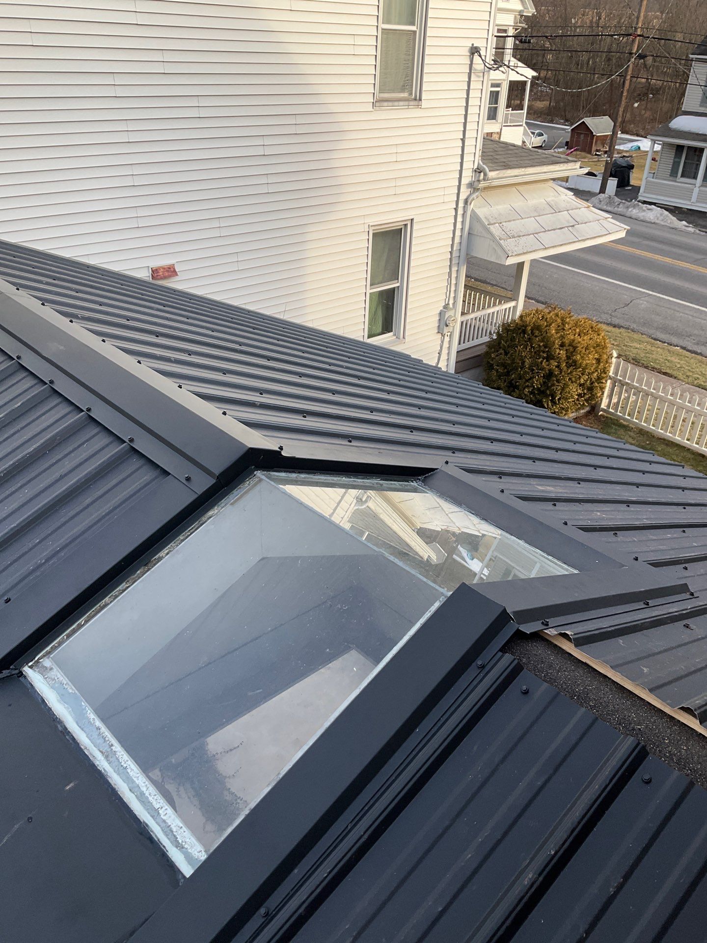 Textured Black Meal Roof by Esh Builders