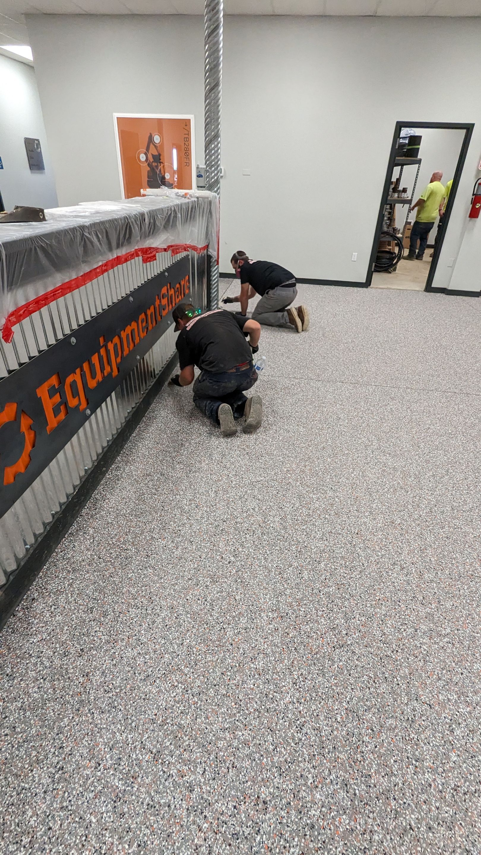 Equipment Share Commercial Floor Transformation using Smoke w/ 5% Orange by Croc Coatings, LLC