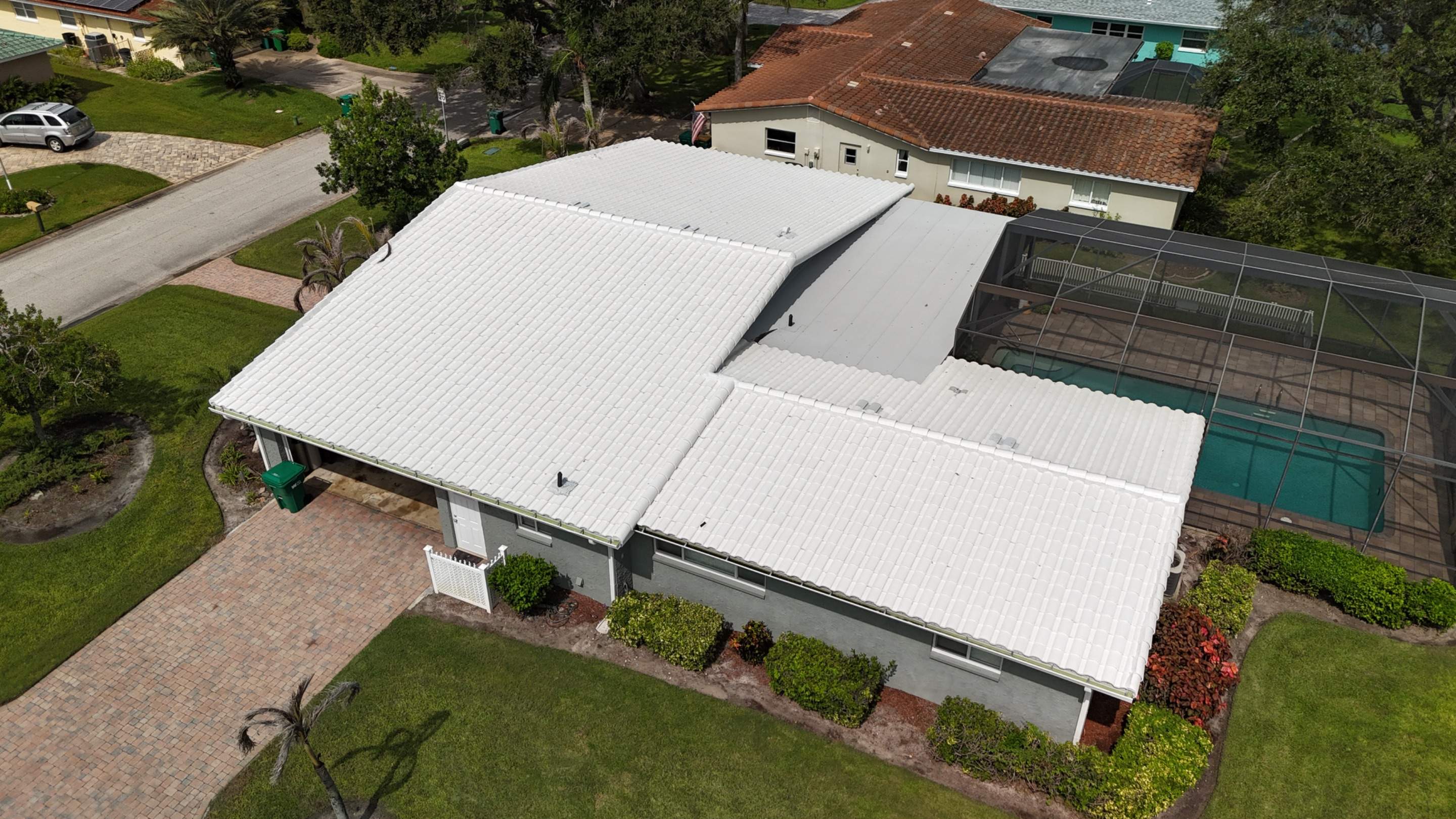 Comprehensive Concrete Tile and Flat Membrane Roof Replacement in Cocoa Beach by Wiedmann Construction & Roofing
