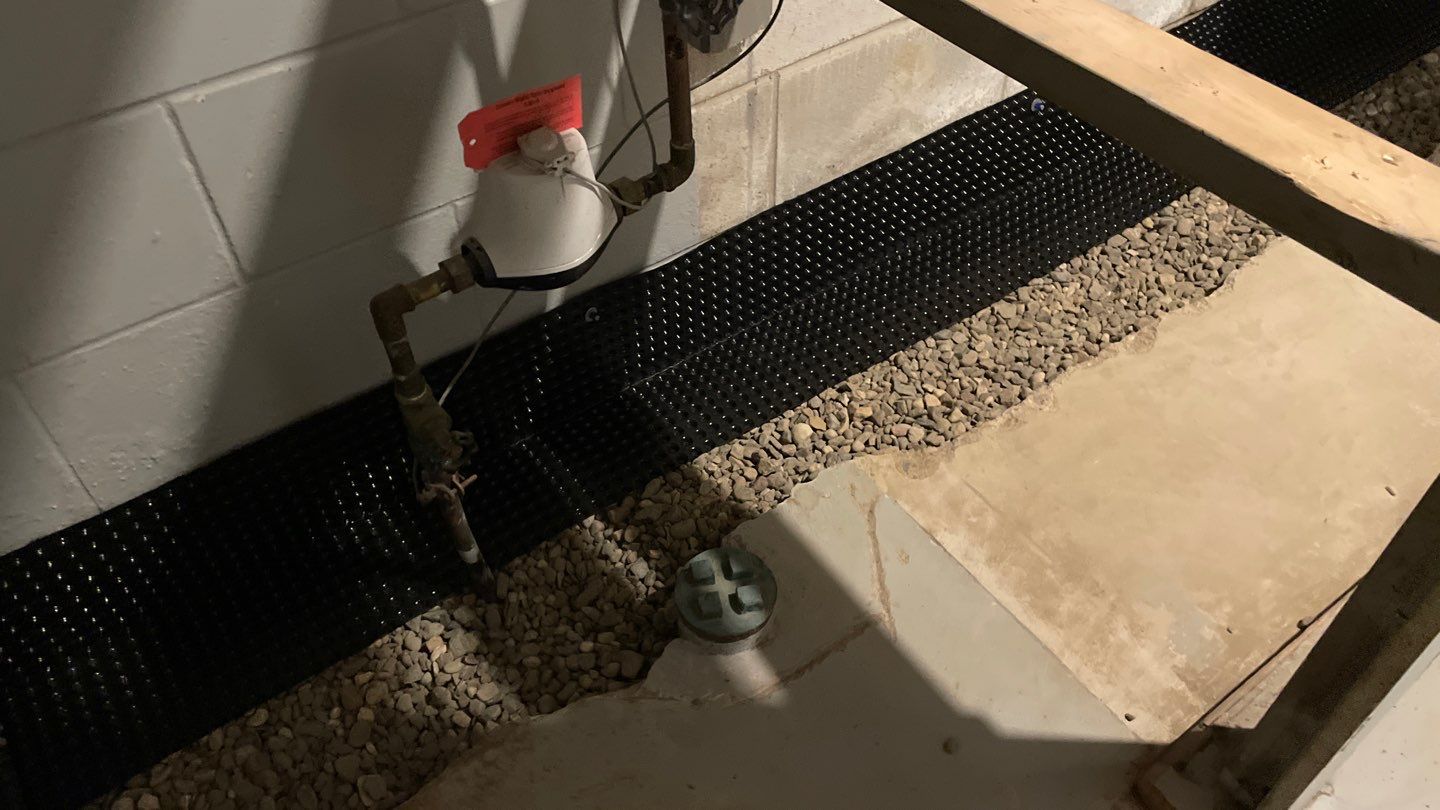 Drain Tile, Sump Pump & Buried Discharge in Columbia Heights by Waterproofing Northeast