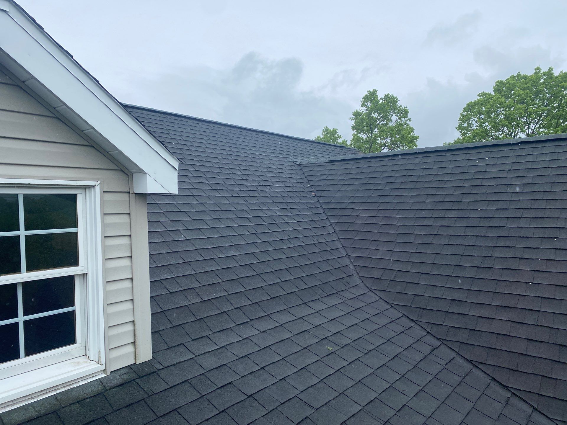 Green Metal Roof and Custom Covered Deck in Duncannon by Esh Builders