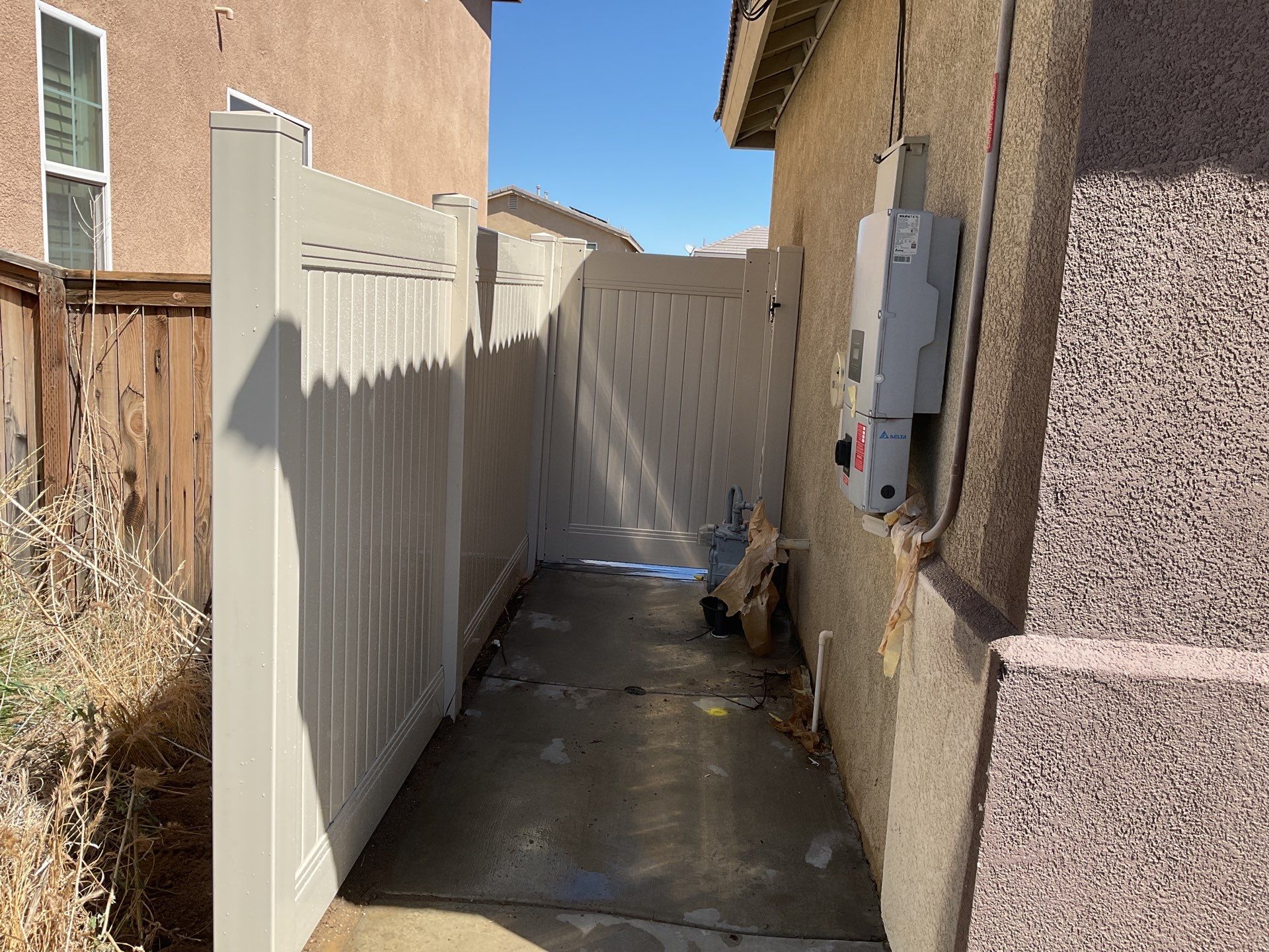 Tan Vinyl by Fence Guys Inc. 