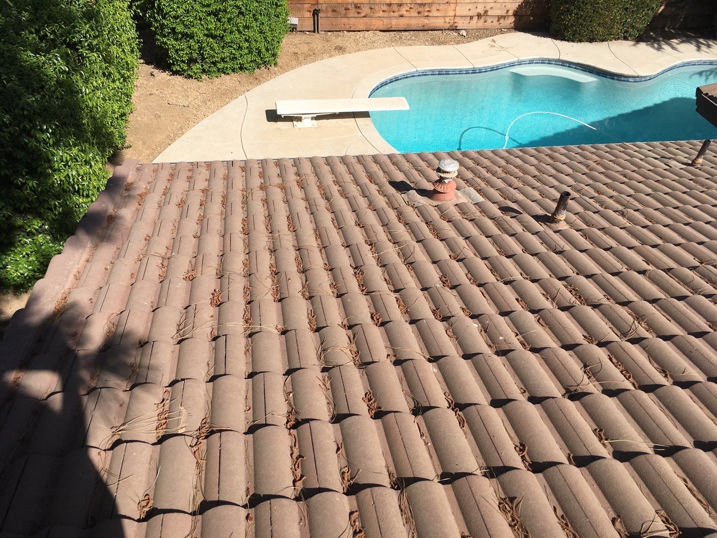 Tile roof remodel/ install OSB sheathing under tile and replace using OSB board with new underlayment, tile, and battens by Straight Edge Roofing Inc