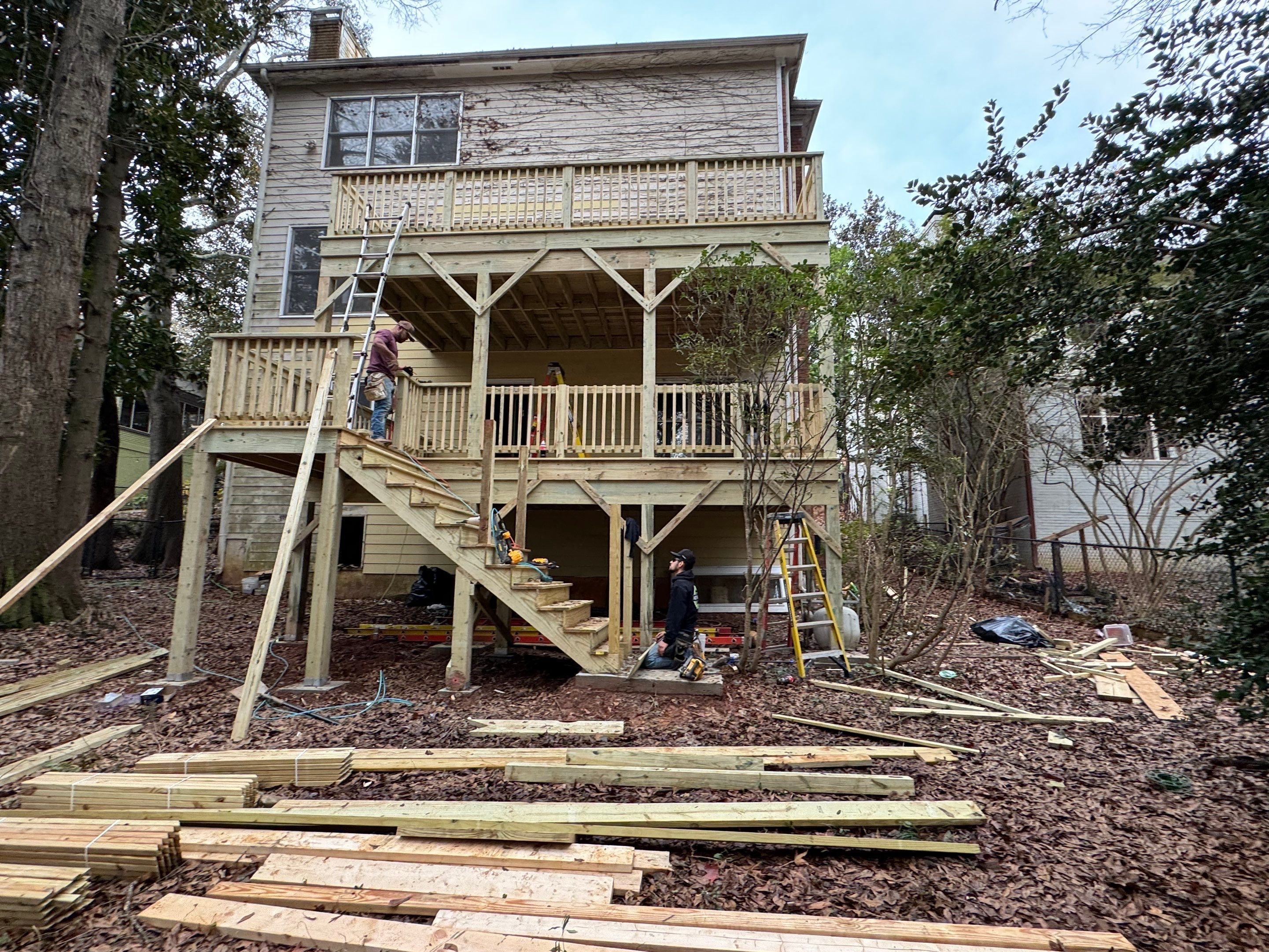 Multi-Level Pressure-Treated Wooden Deck Construction in Decatur by Swift Home Renovations