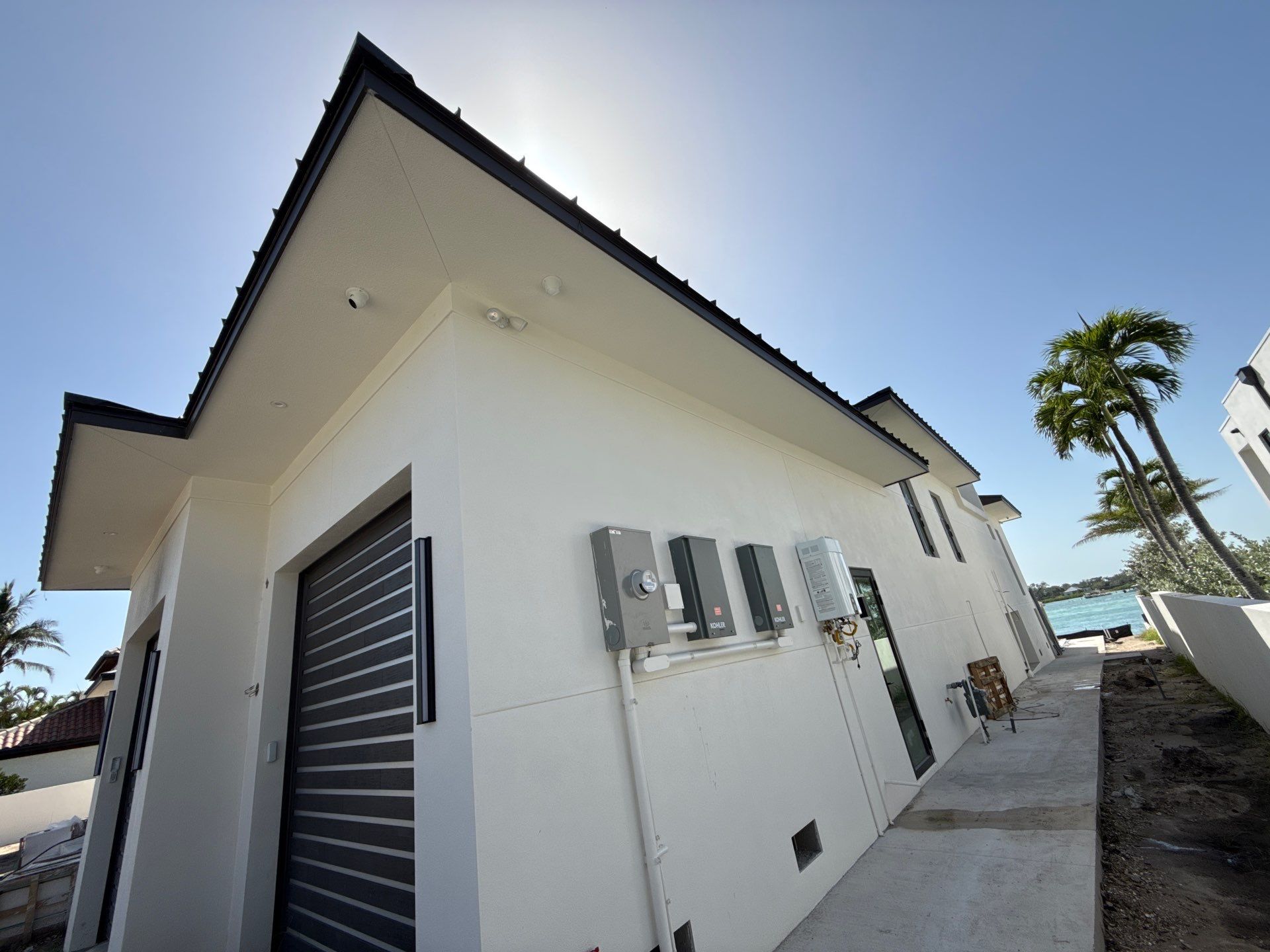 Seamless Aluminum Gutter Installation using black seamless gutters in Sarasota FL by Gutter Professors