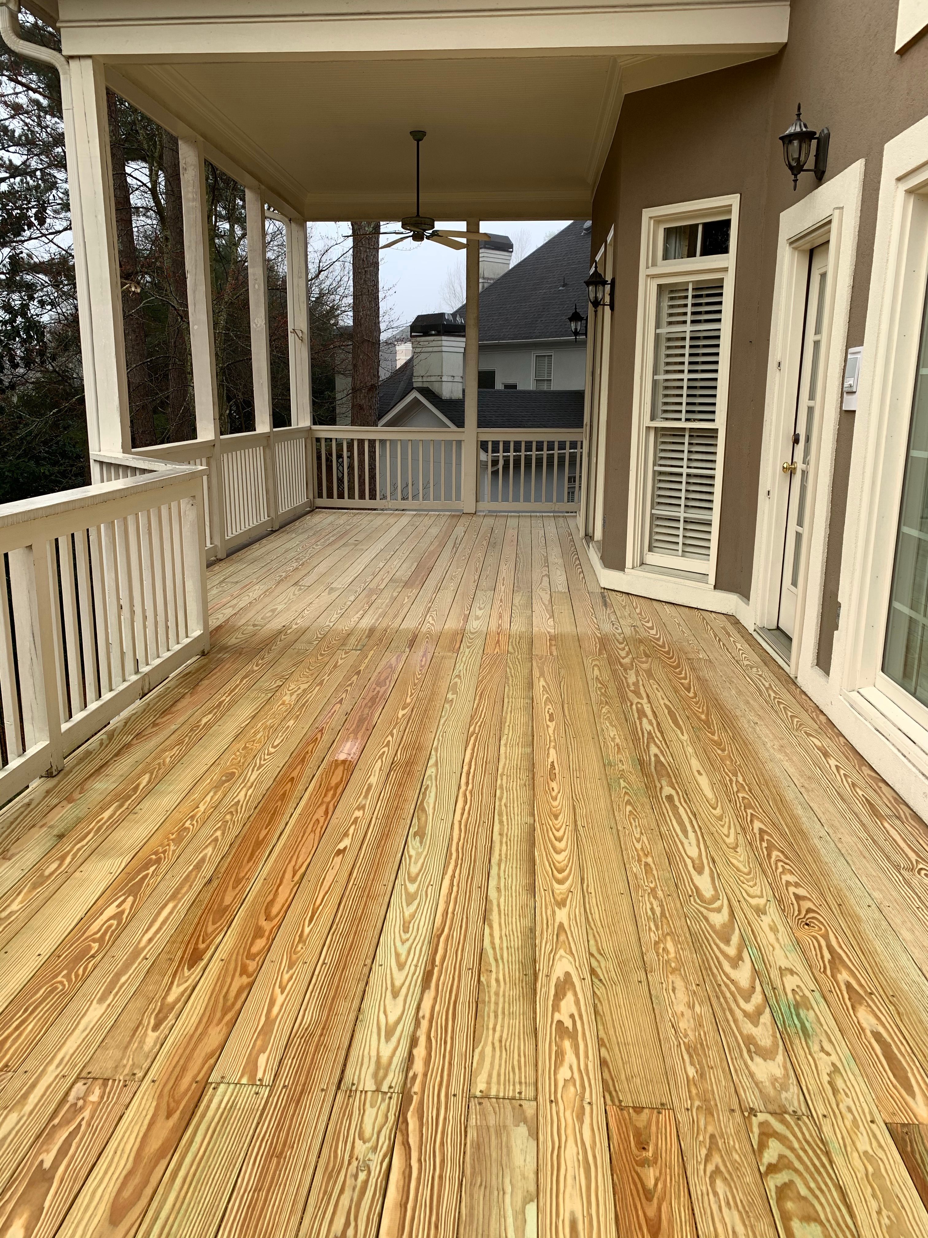 Pressure-Treated Wood Deck Renovation and Railing Refresh in Duluth by Swift Home Renovations 