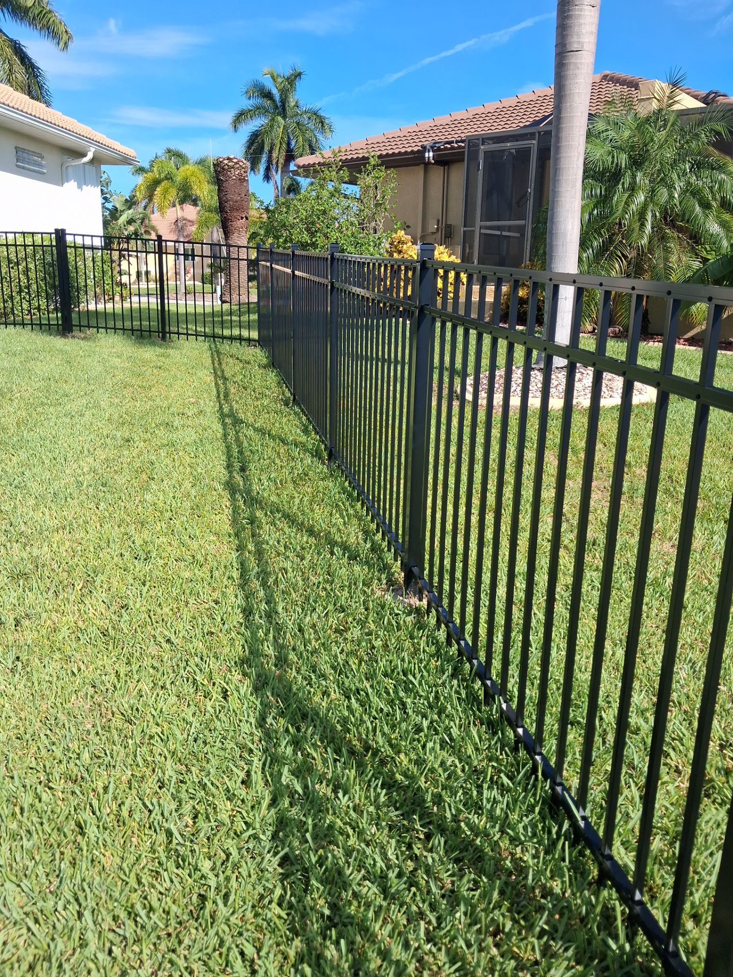 Custom Black Aluminum Fence Enclosure for Punta Gorda Waterfront Property by True Fence LLC