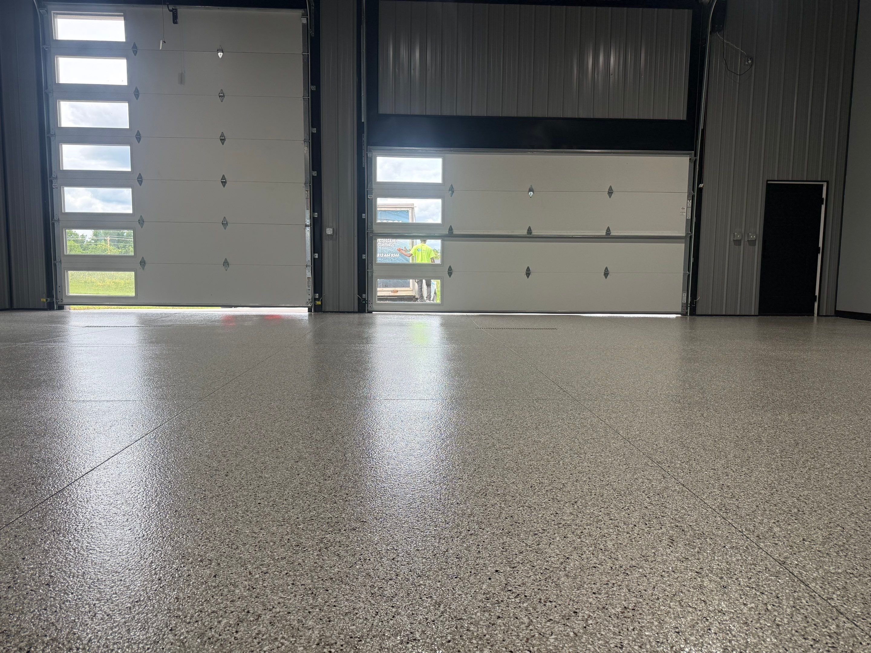Polyaspartic Garage Floor Coating with Decorative Flake in Wentworth by Select Painting, Coatings & Garage Cabinets