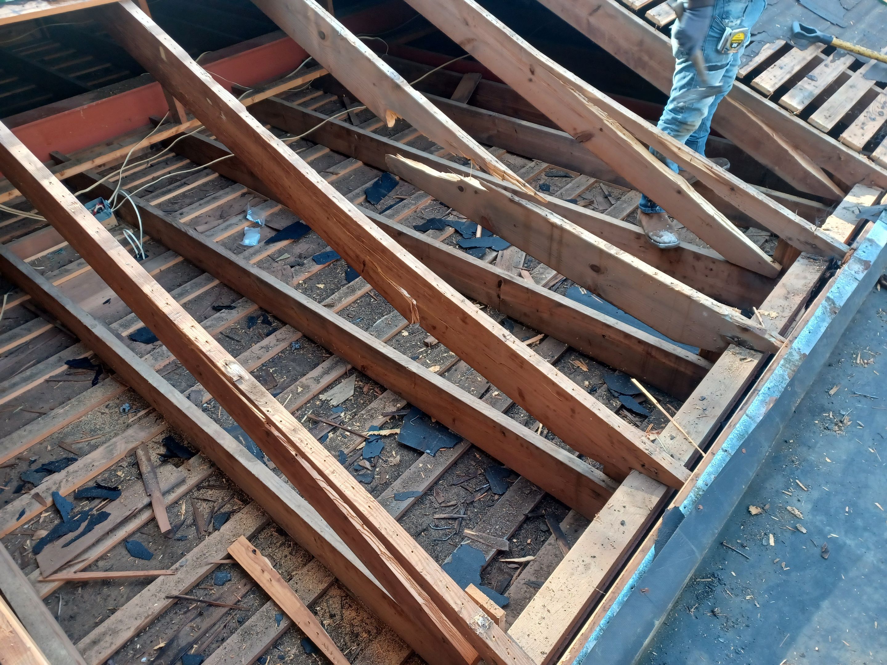 Residential Roofing Installation using PVC membrane and 24 gauge Standing Seam Metal by Hostetler Roofing