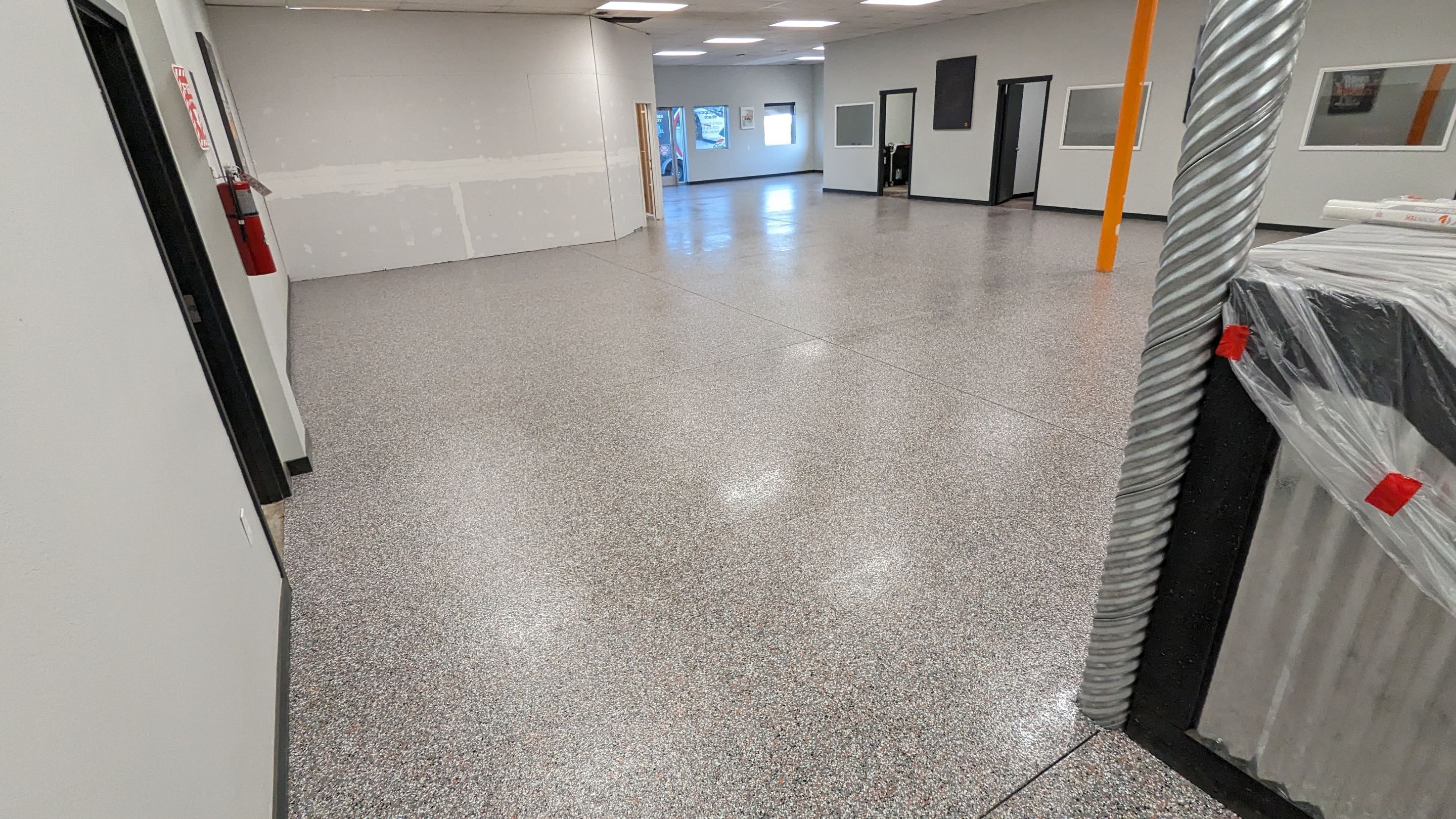 Equipment Share Commercial Floor Transformation using Smoke w/ 5% Orange by Croc Coatings, LLC