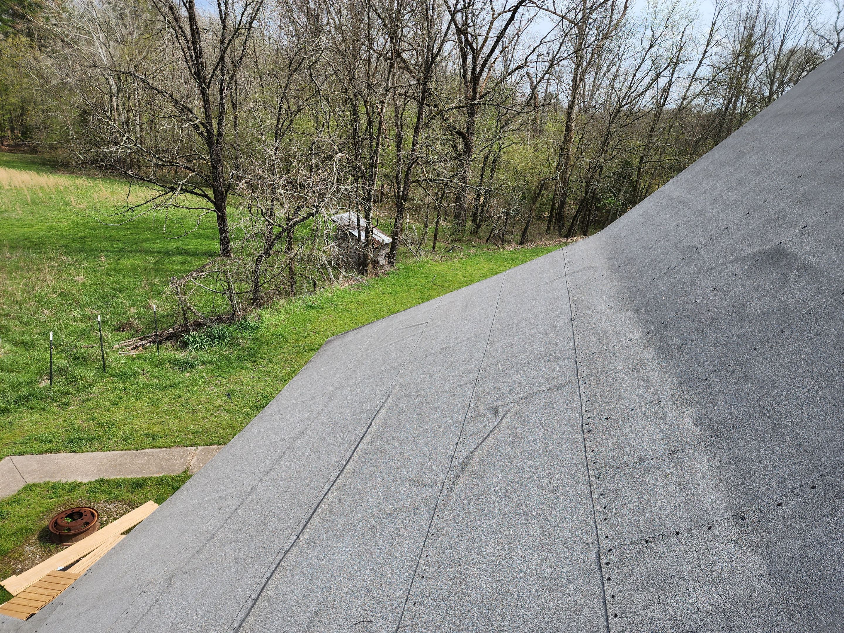 Residential Roofing Installation using 26 Gauge Colored Panels by Hostetler Roofing