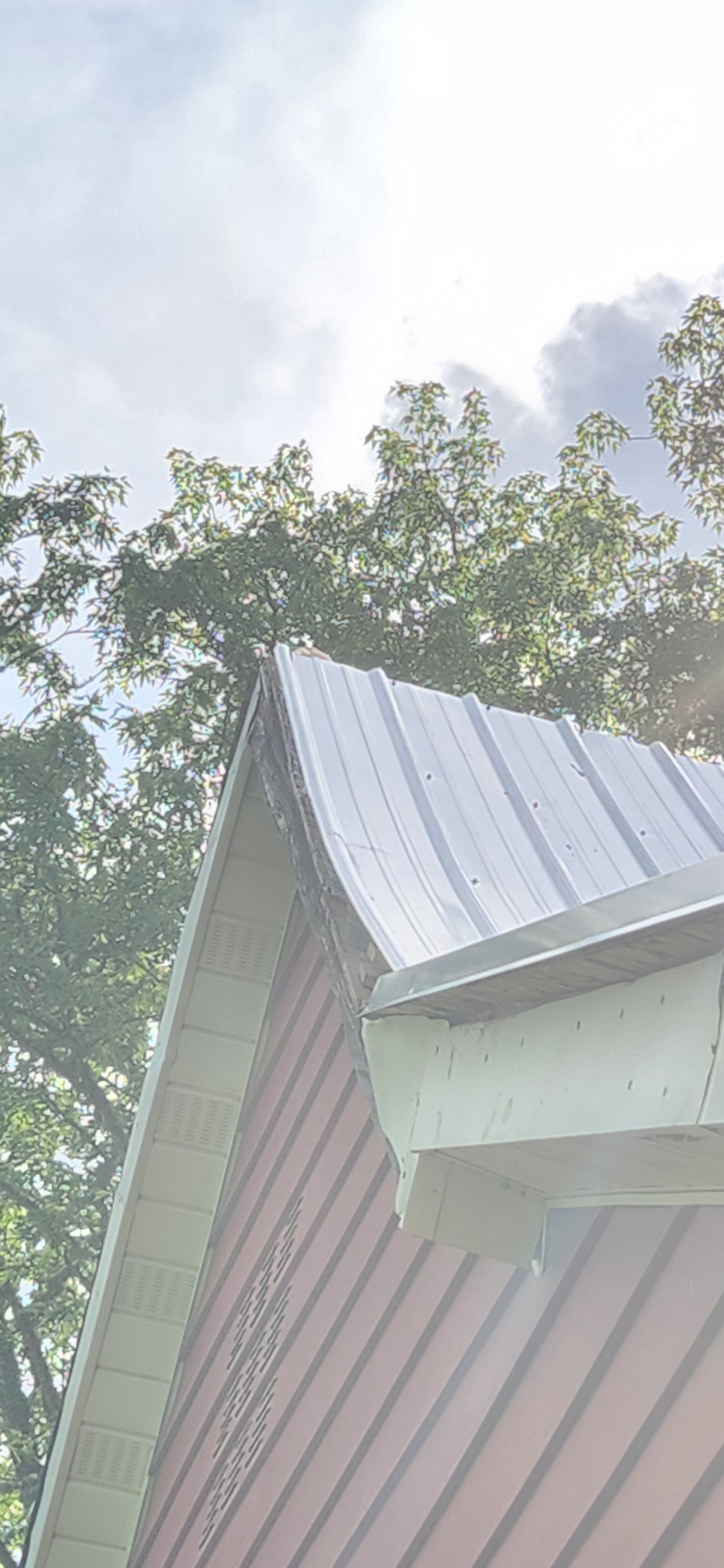 Residential Roofing Installation using 26 Gauge Colored Panels by Hostetler Roofing
