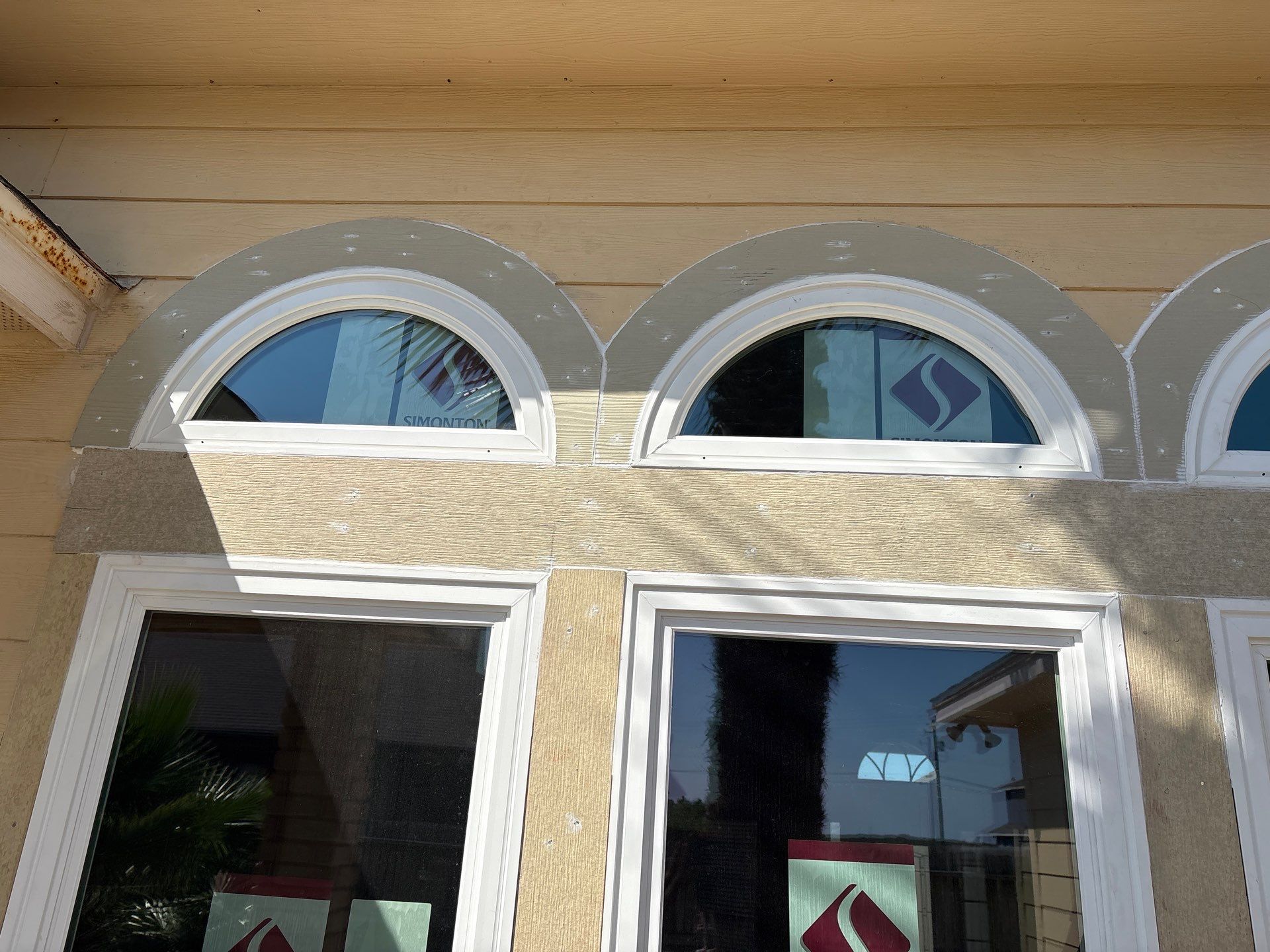 Curved Trim Windows by Bayfront Roofing and Construction
