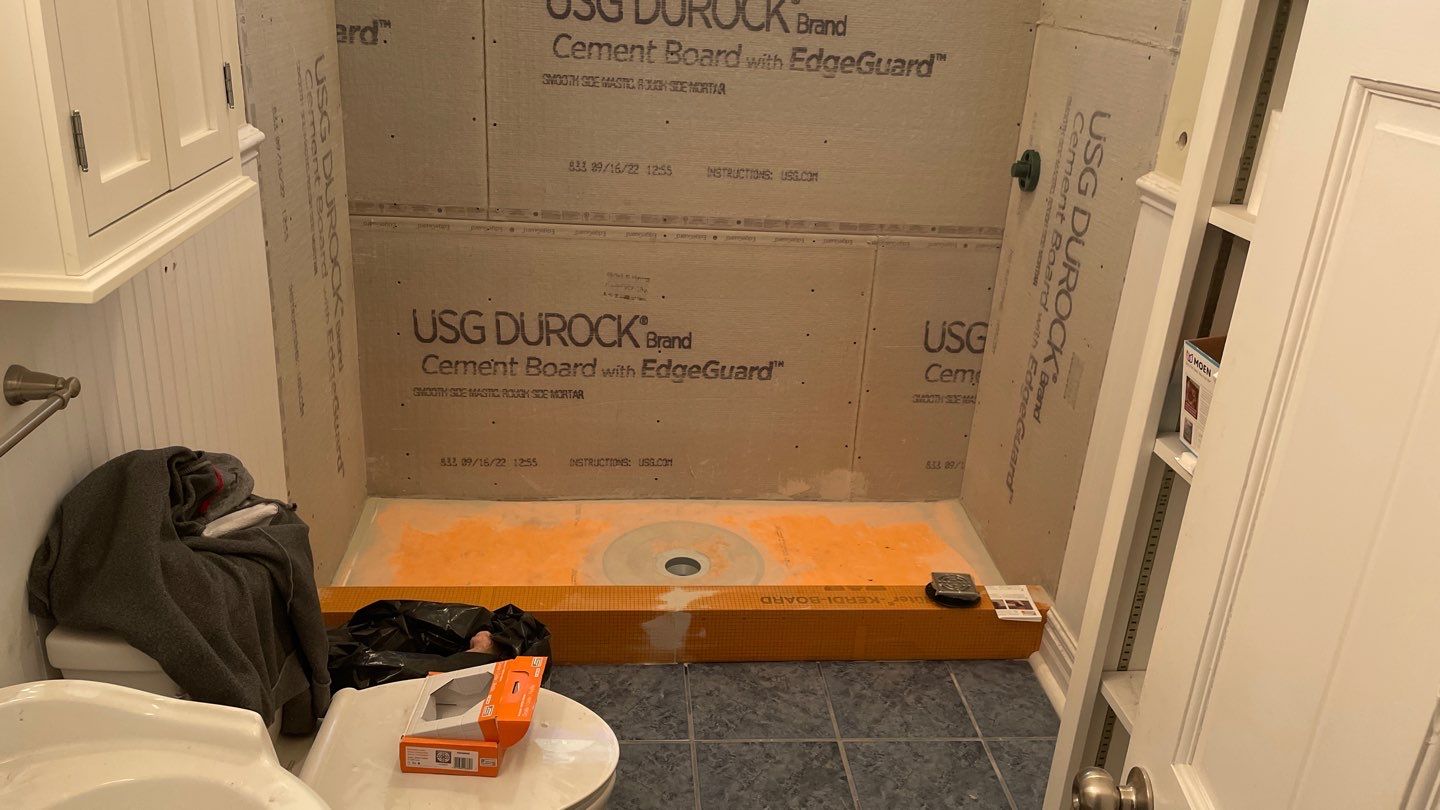 Shower Transition Highlighting Stained Glass Window by Footprints Floors of Coastal Carolina