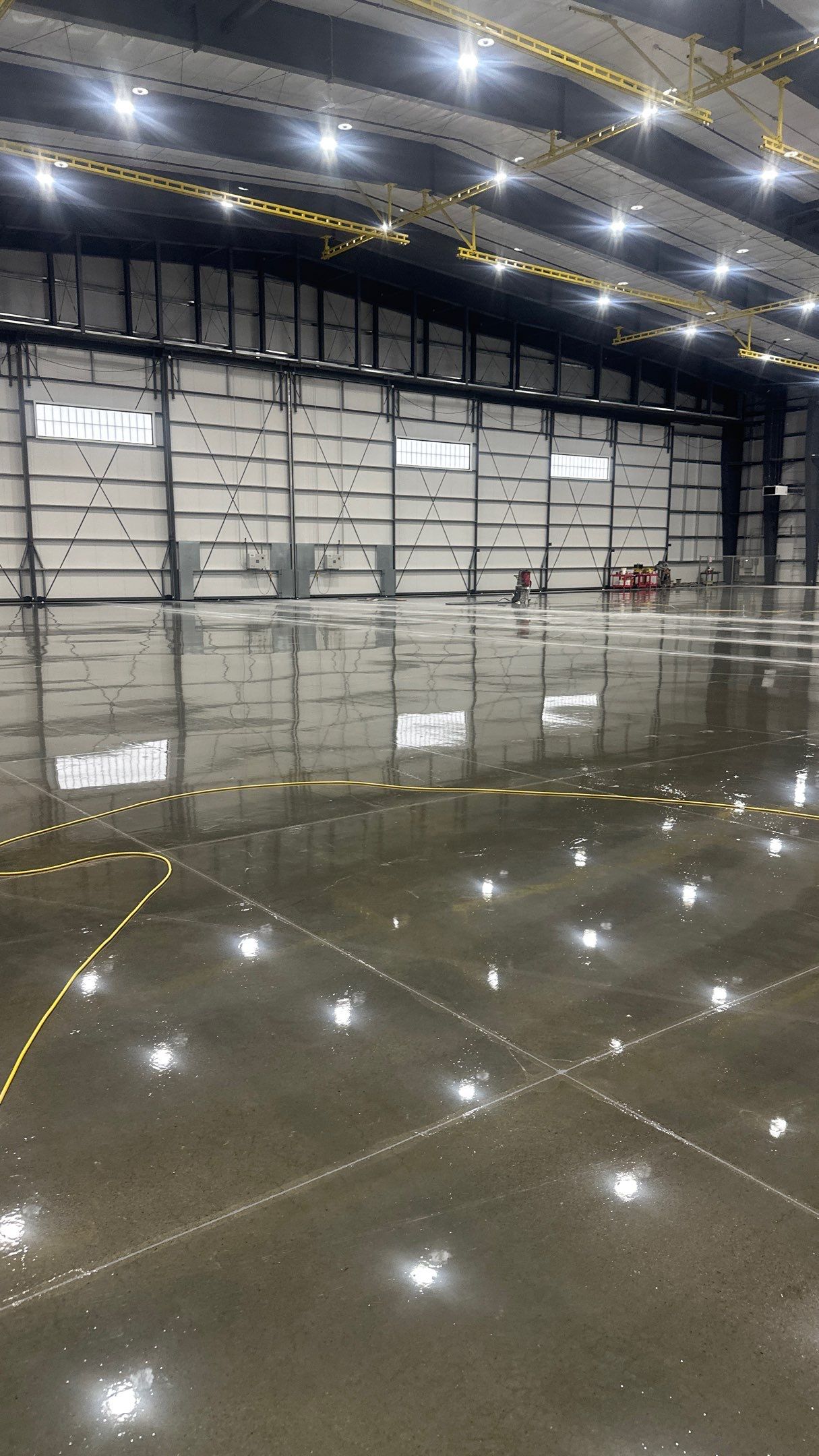 Airplane Hanger using Light Grey Commercial Penntek Epoxy by Croc Coatings, LLC