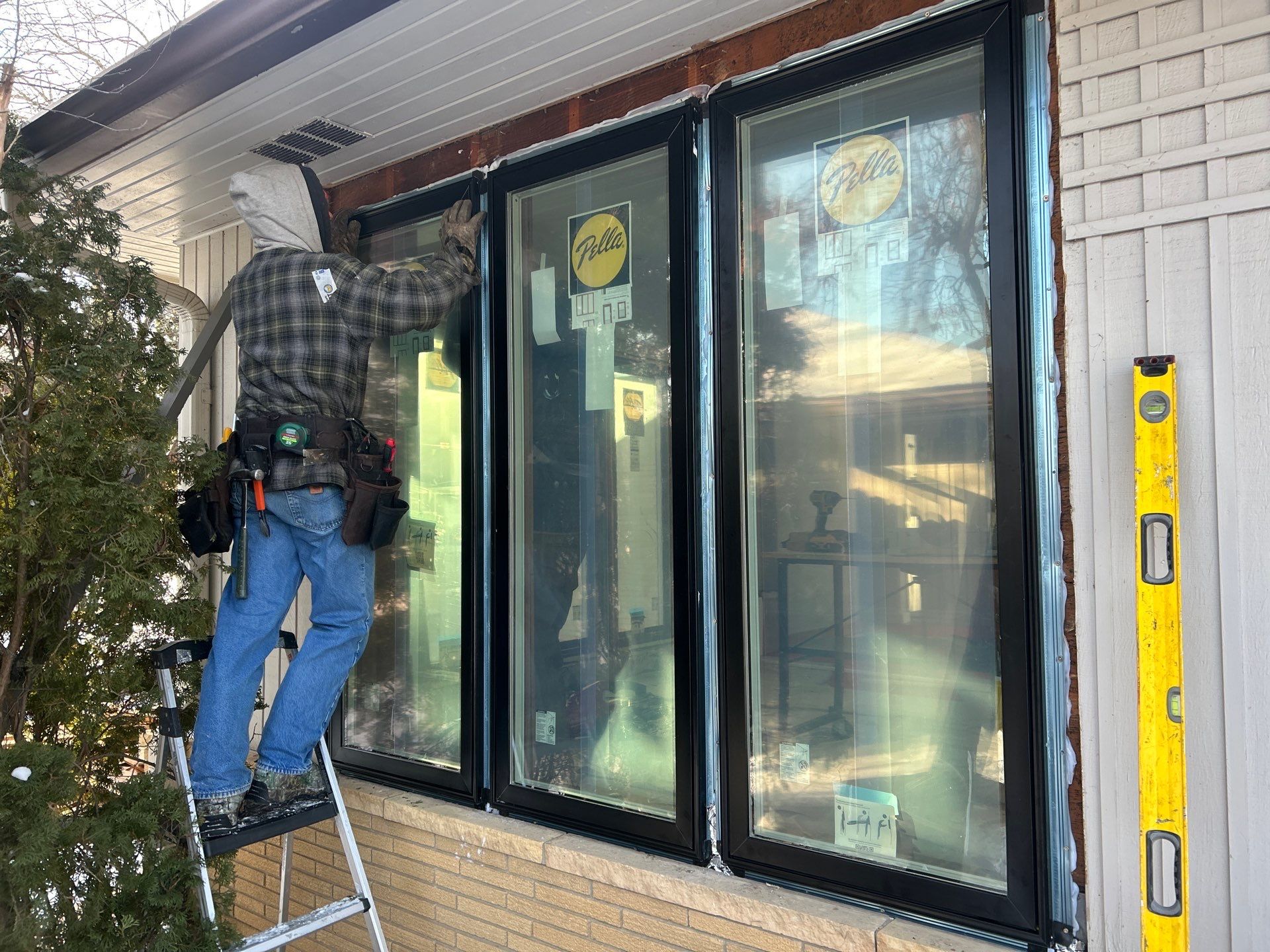 Black-Frame Pella Lifestyle Upgrade on a Partial Brick Home by United Windows and Siding LLC