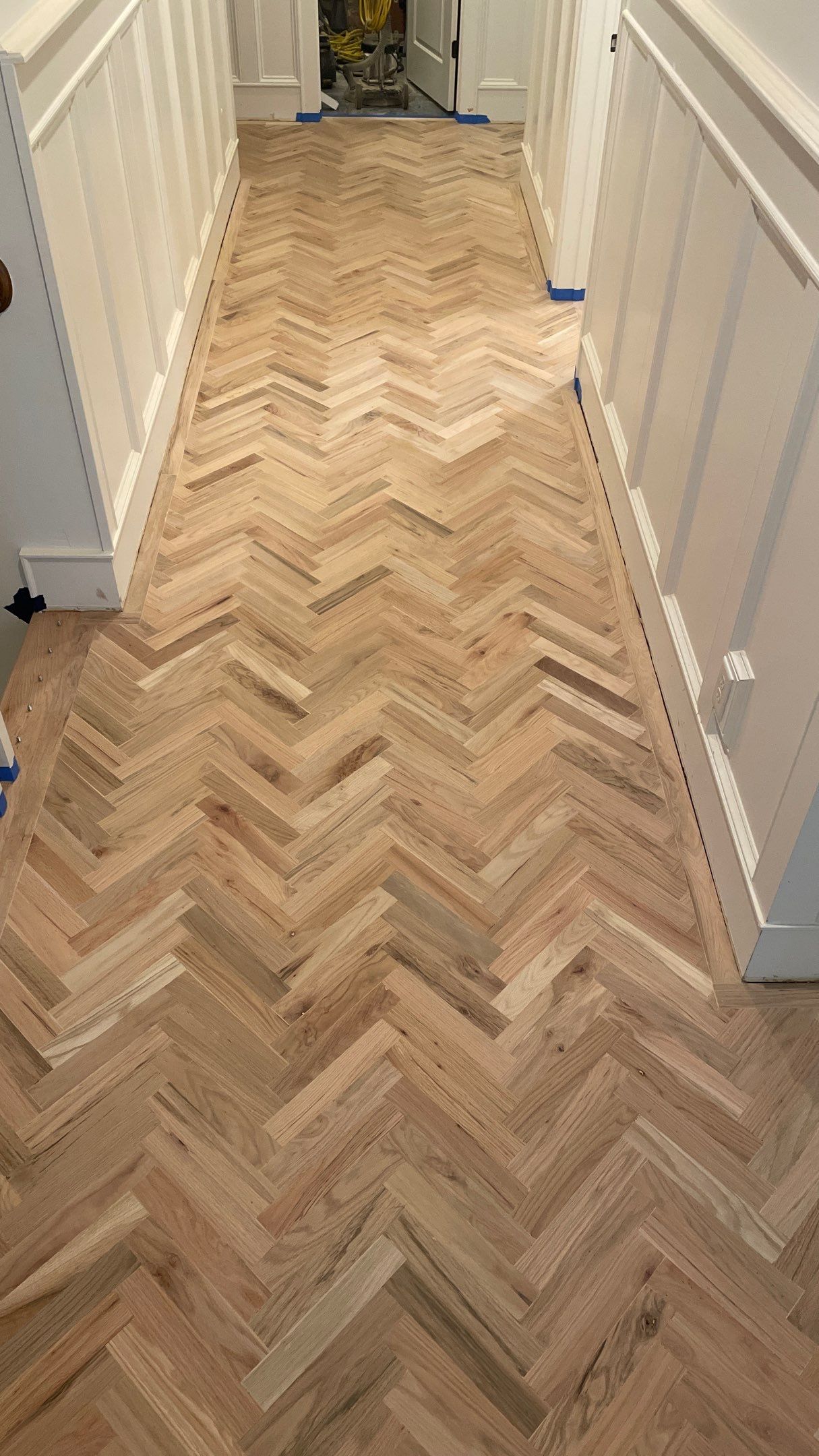 Herringbone Wood Hallway and Rooms by Footprints Floors of Coastal Carolina