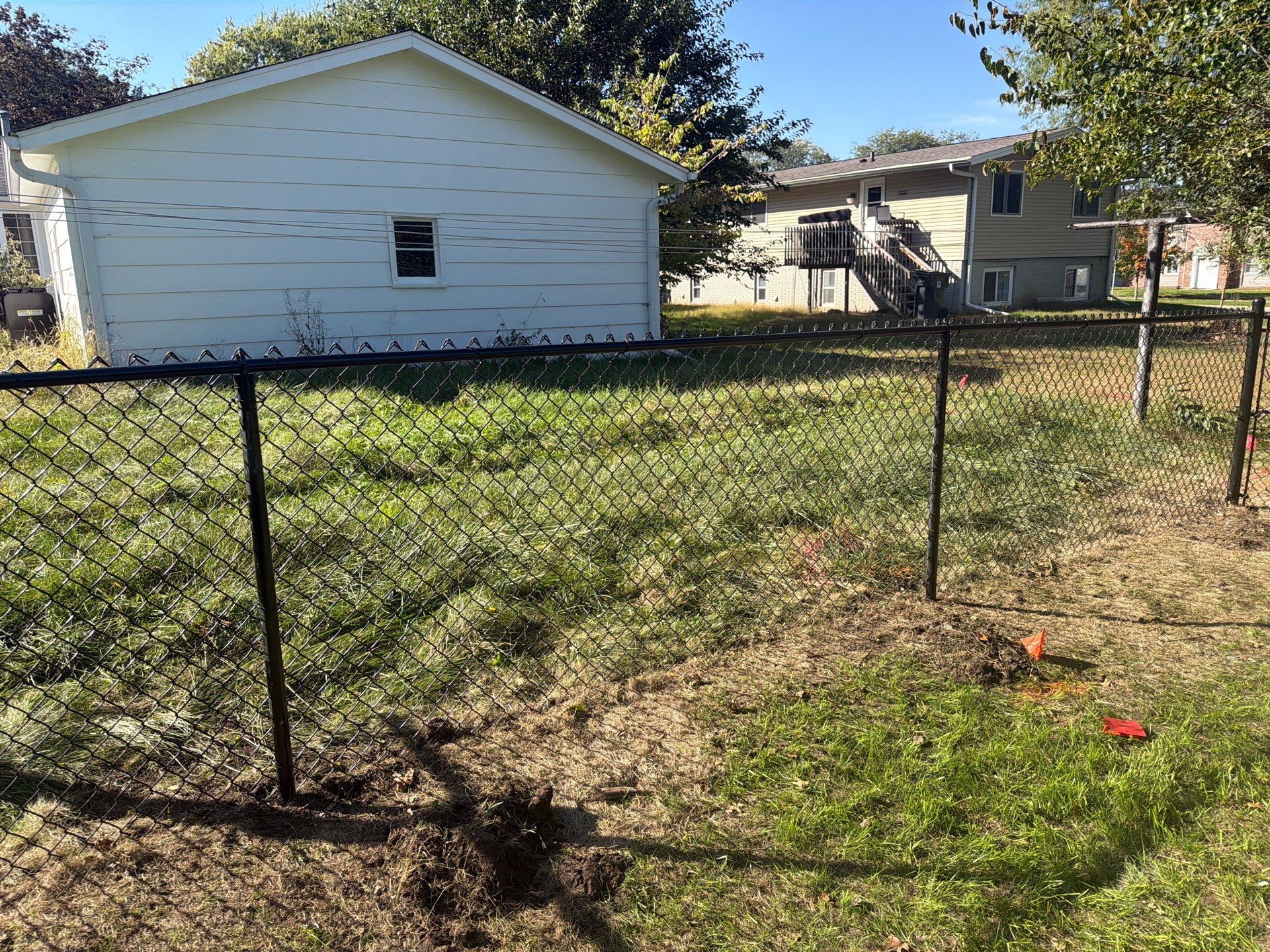 Black Chain Link Fence Installation with Double Gate in Cedar Falls by Perfect Picket Fence and Stain