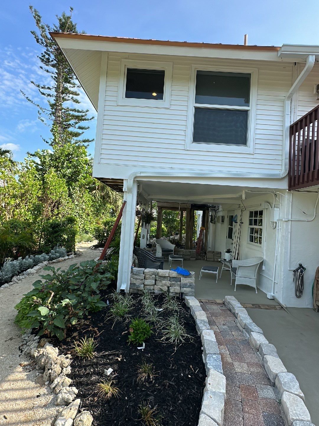 White K-Style Gutters Installed with White Downspouts in Sanibel FL by Gutter Professors
