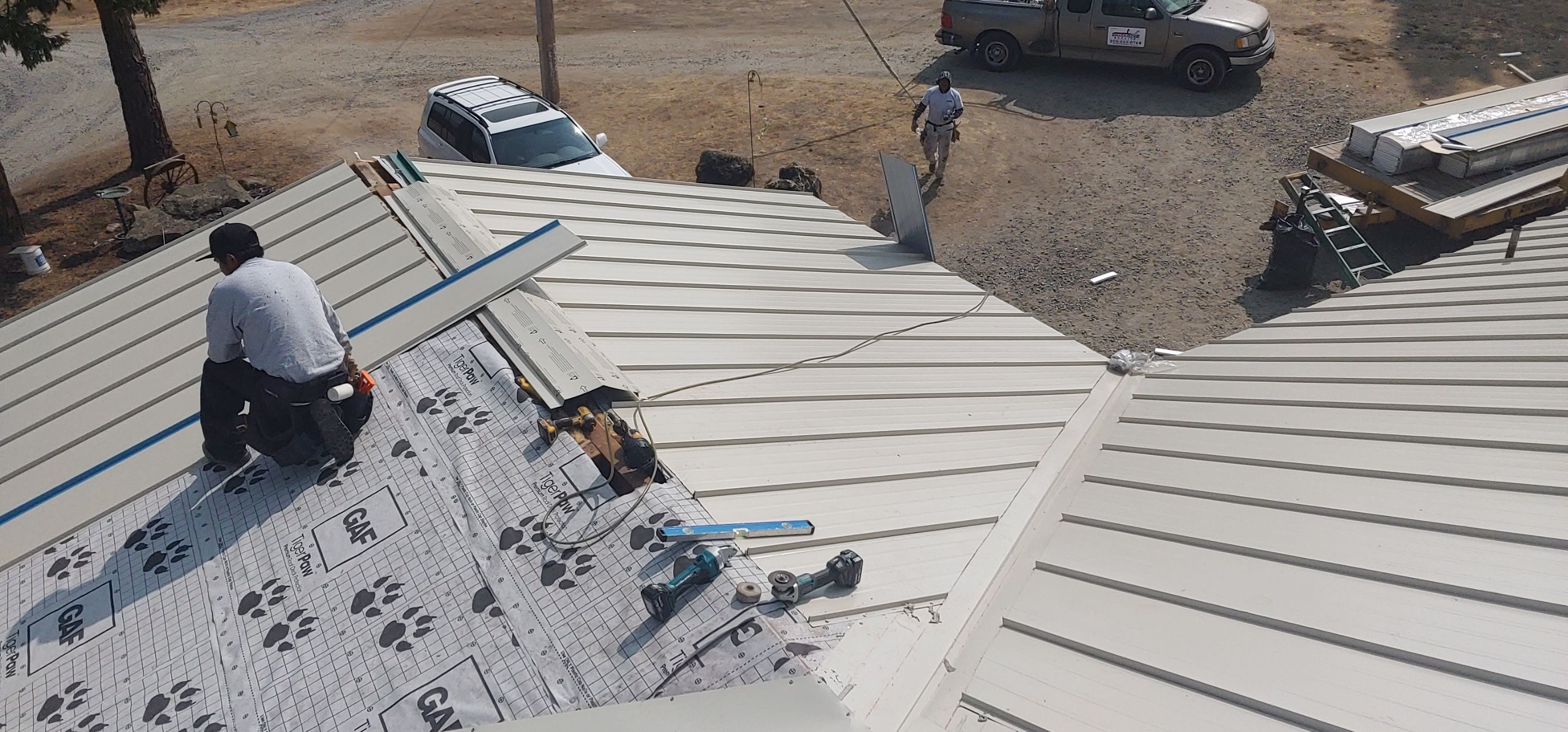 Residential Roofing Installation using Standing seam metal roofing system by Straight Edge Roofing Inc