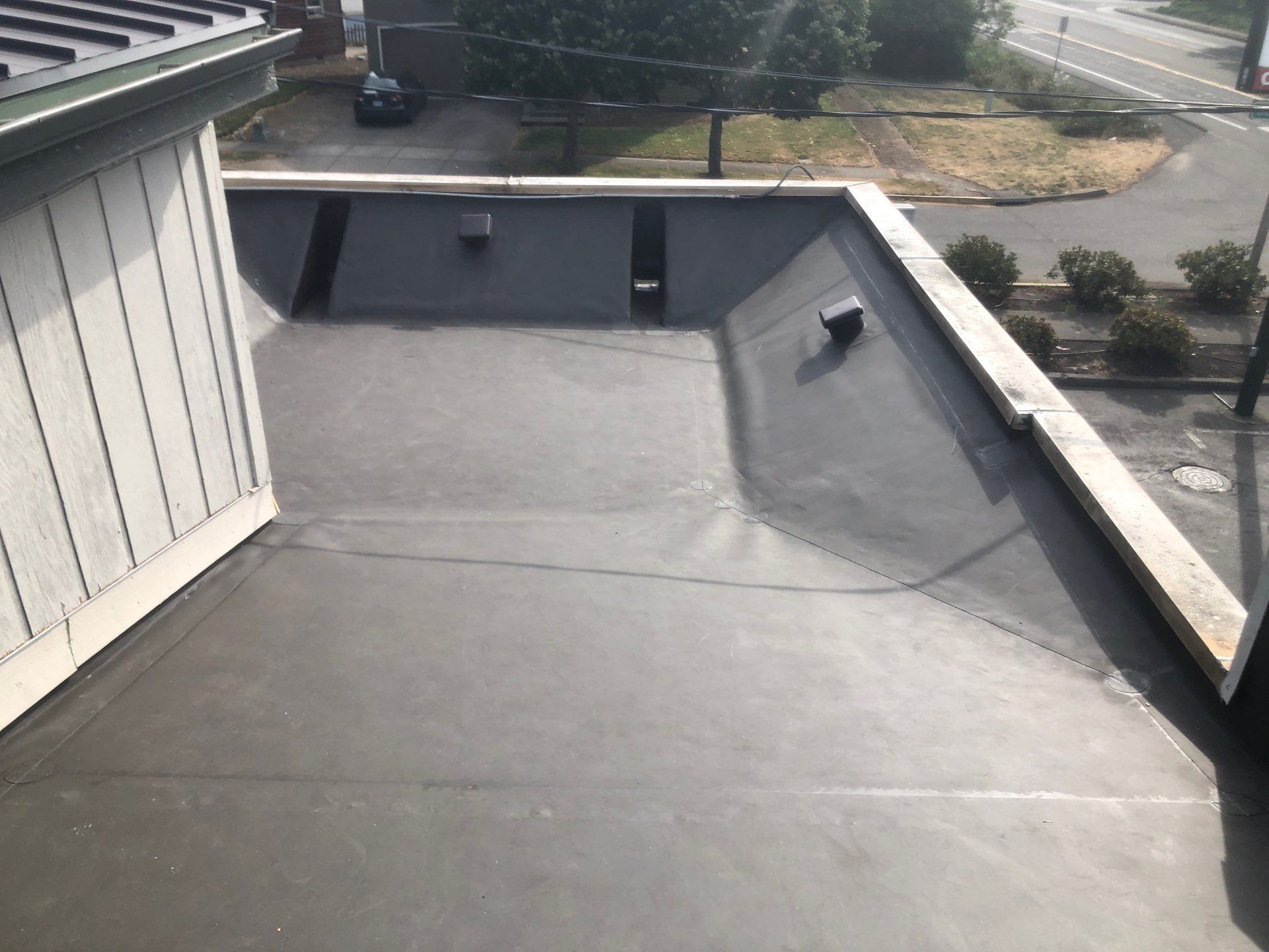 Commercial Flat Roof Installation using Bruce and Dana Snap Lock Metal (Color: Brown) by Orezona Building & Roofing Company, Inc.
