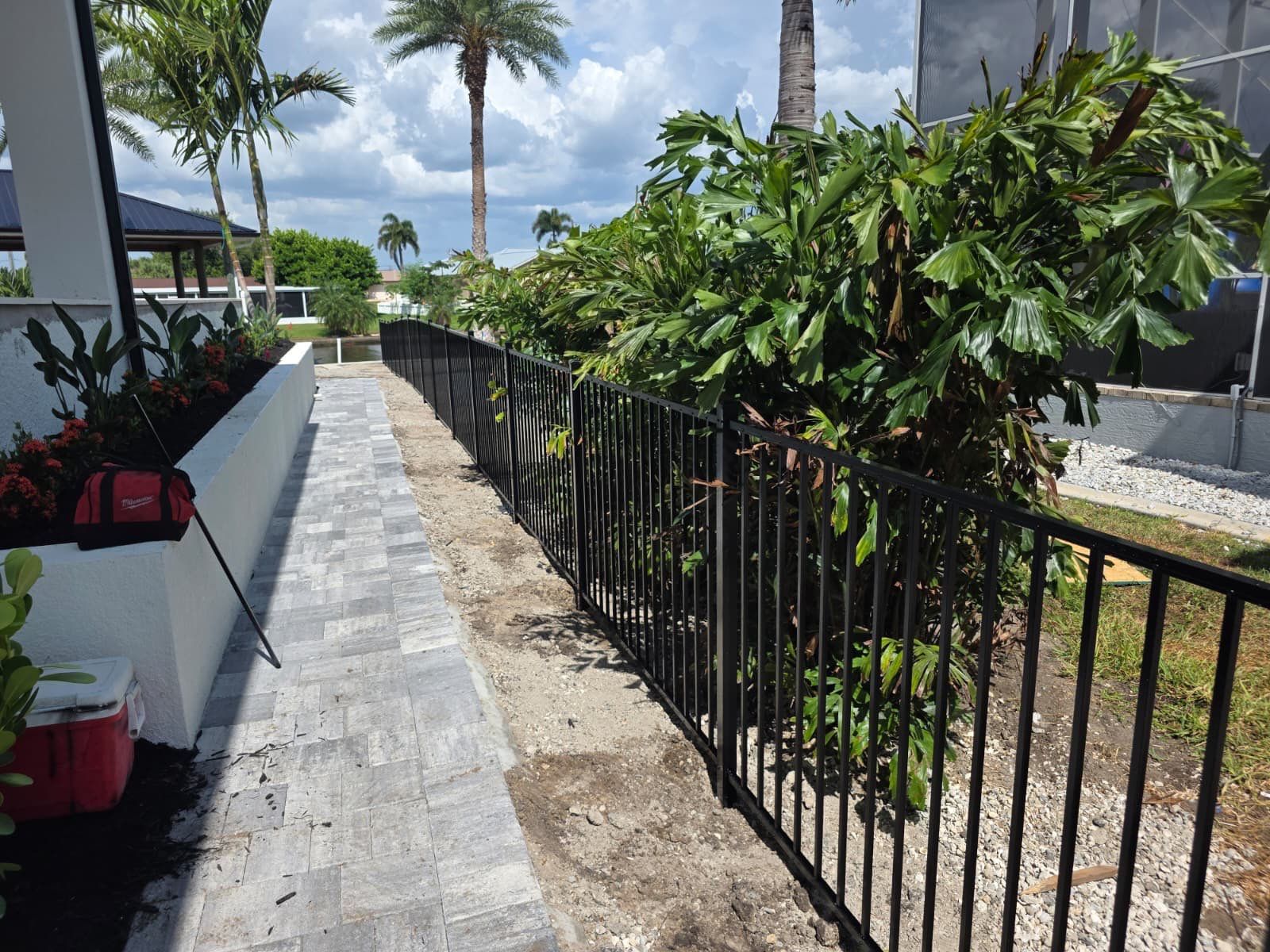 Black Aluminum Fencing and Paver Walkway Installation in Punta Gorda by True Fence LLC