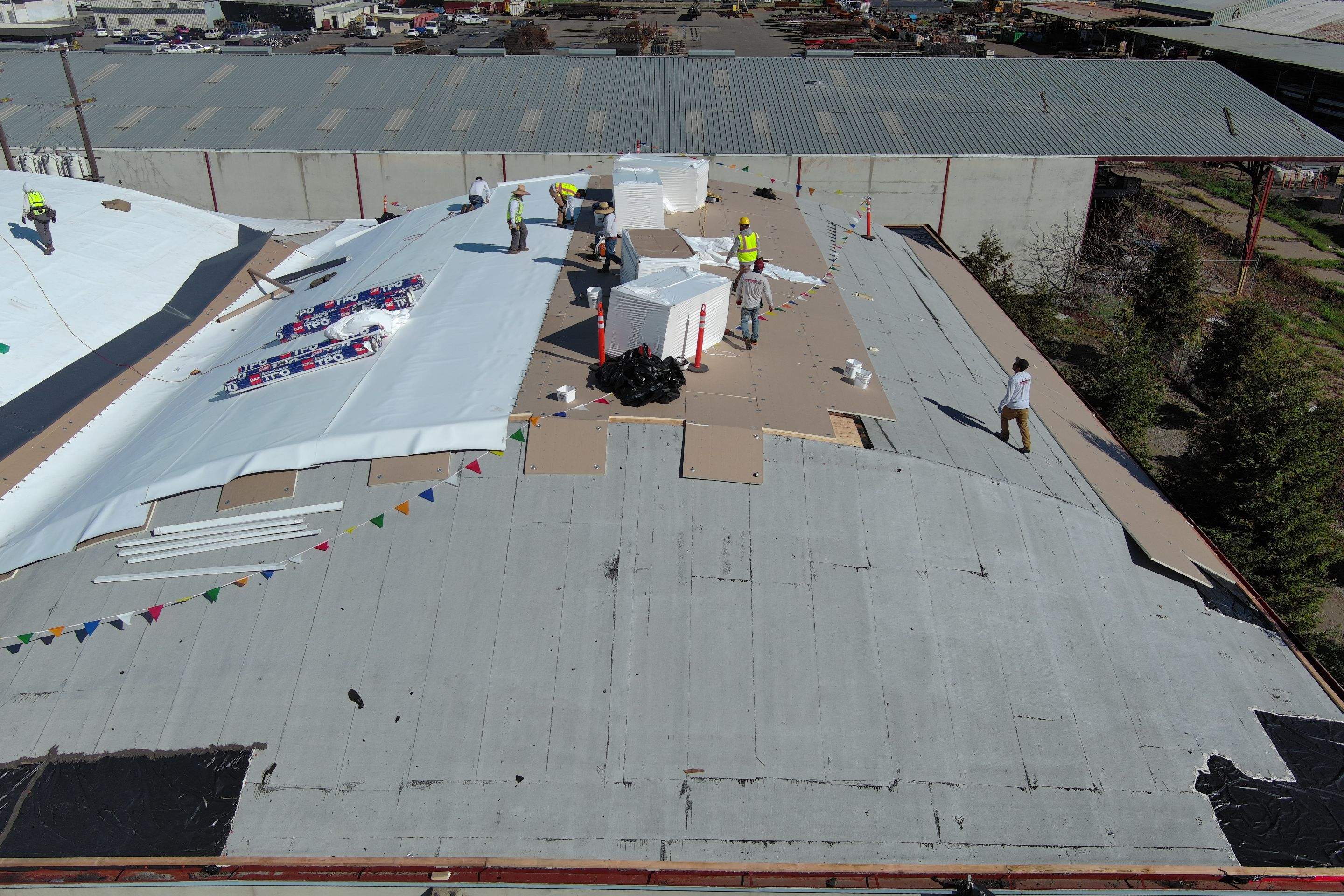 TPO single-ply roofing system using GAF Single-ply TPO 60 mil with 1.5 inch ISO board insulation by Straight Edge Roofing Inc